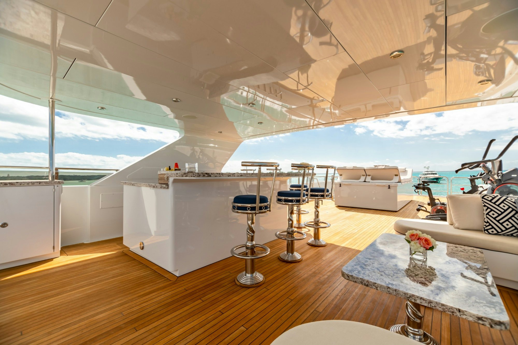 a room with a table and chairs aboard AMORE Yacht for Charter