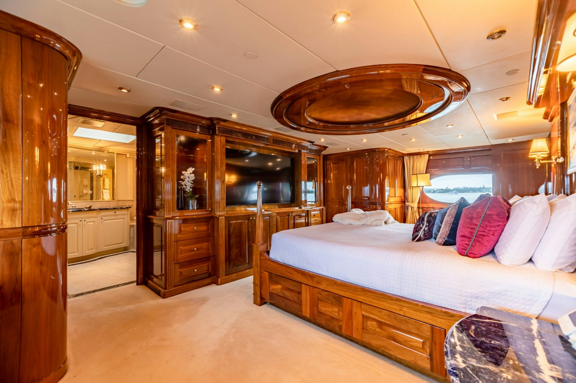 a large bedroom with a large bed aboard AMORE Yacht for Charter