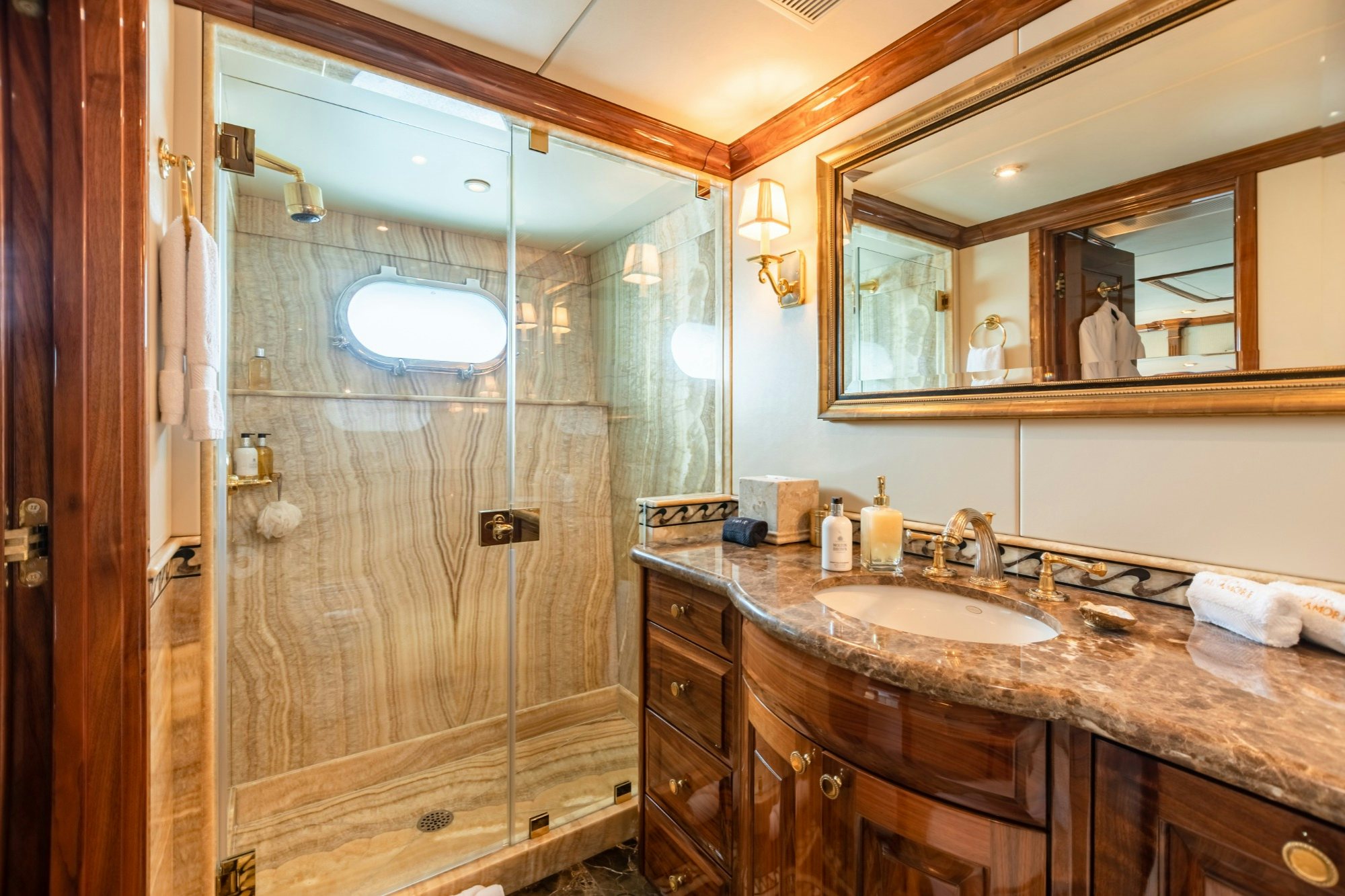 a bathroom with a glass shower aboard AMORE Yacht for Charter
