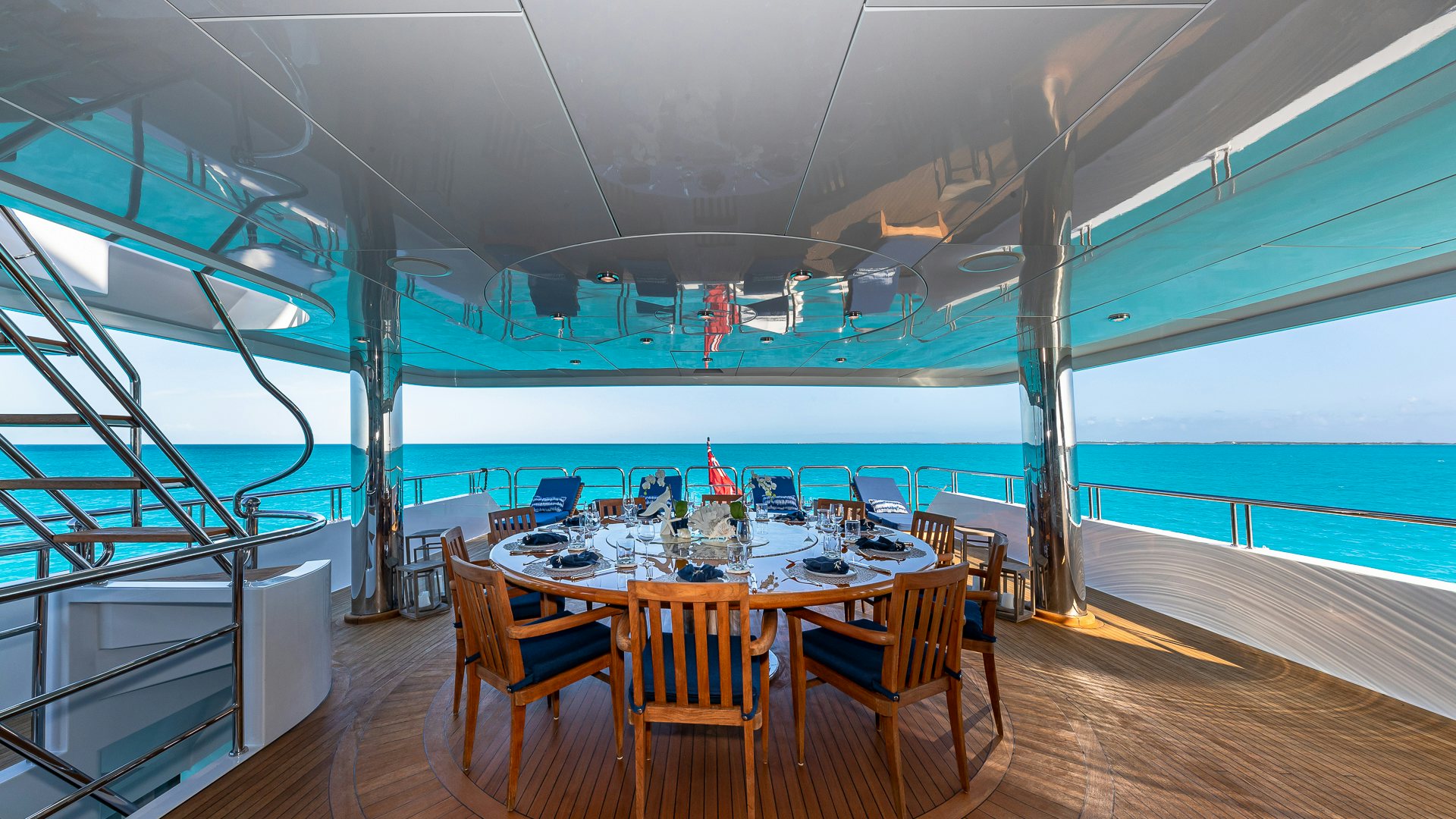 a room with a table and chairs aboard AMORE Yacht for Charter