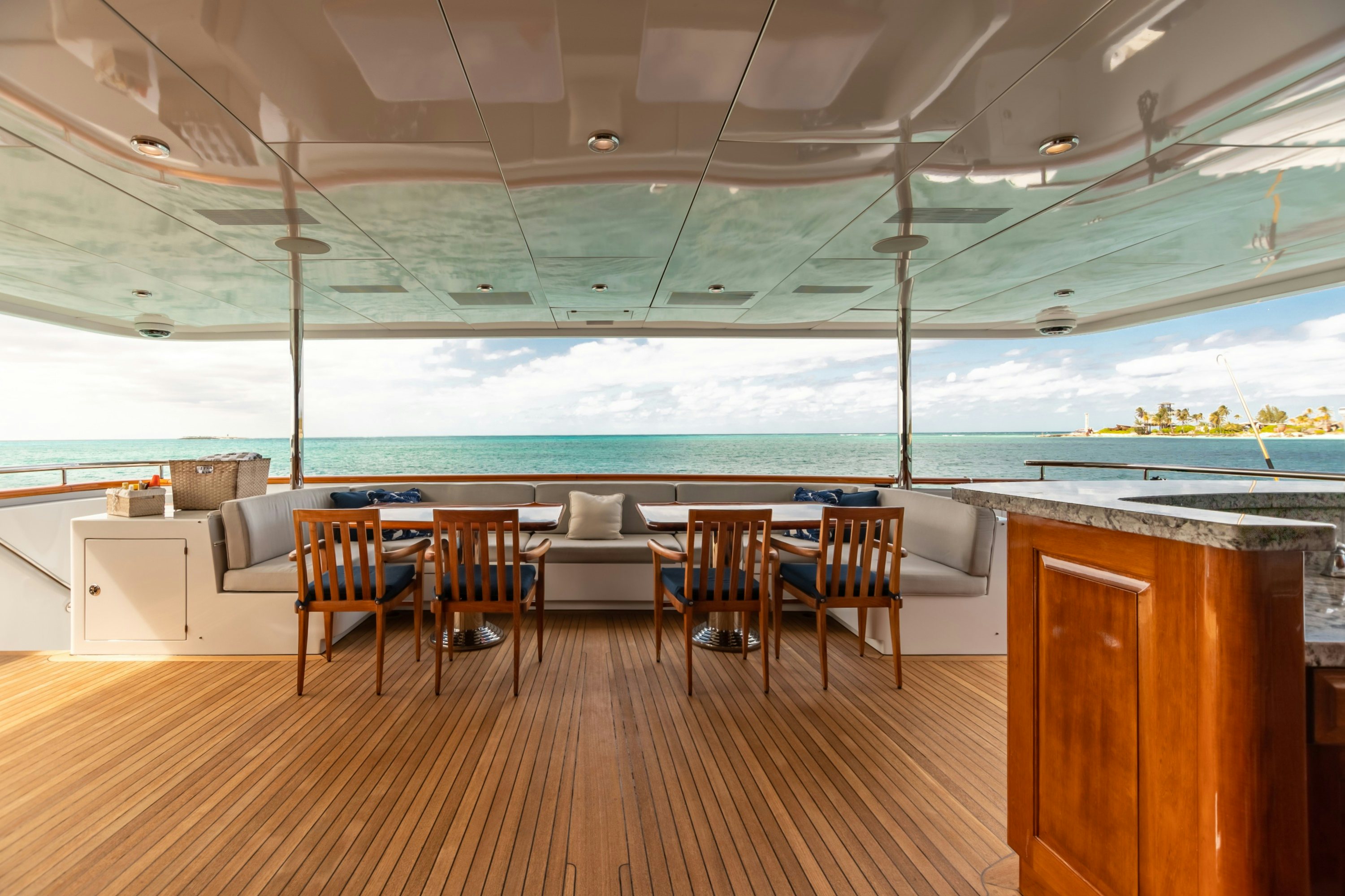 a room with a table and chairs aboard AMORE Yacht for Charter