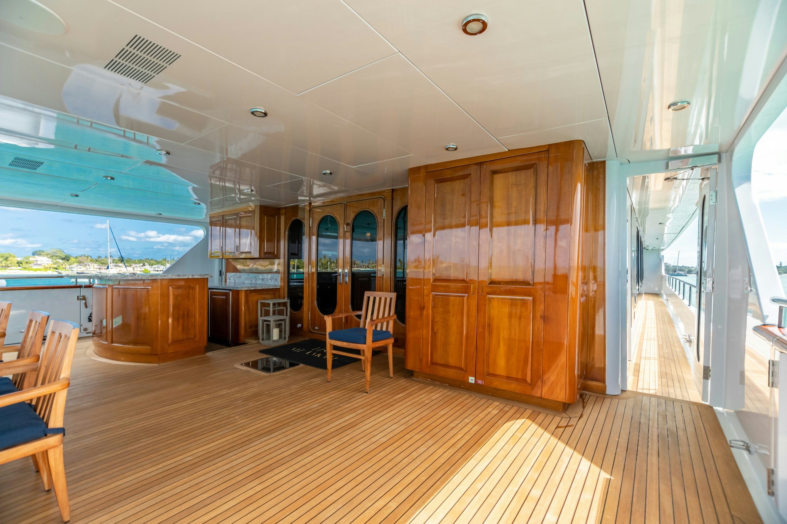 a room with wooden cabinets and a wood floor aboard AMORE Yacht for Charter