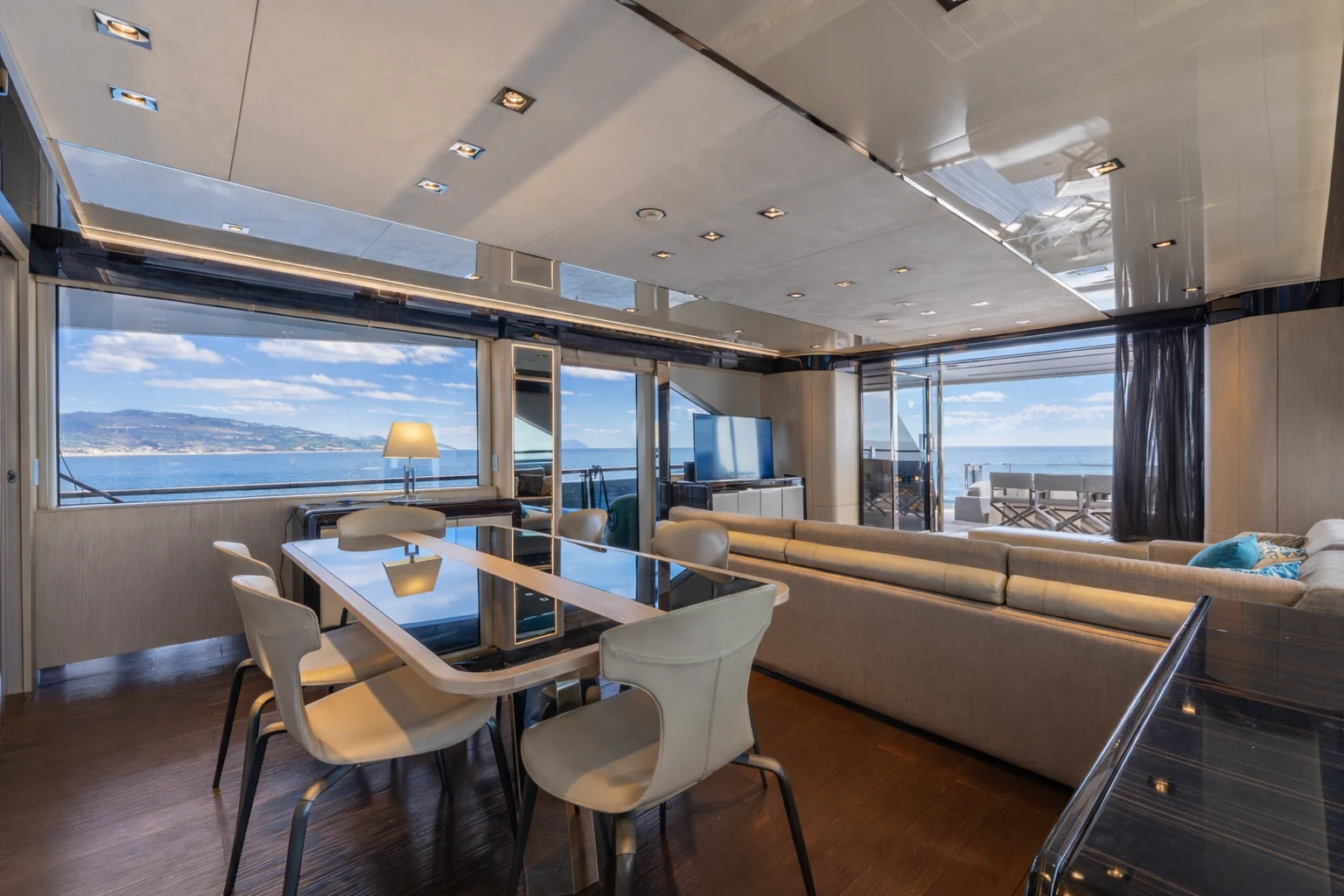 a room with a table and chairs aboard ZALANKA Yacht for Sale