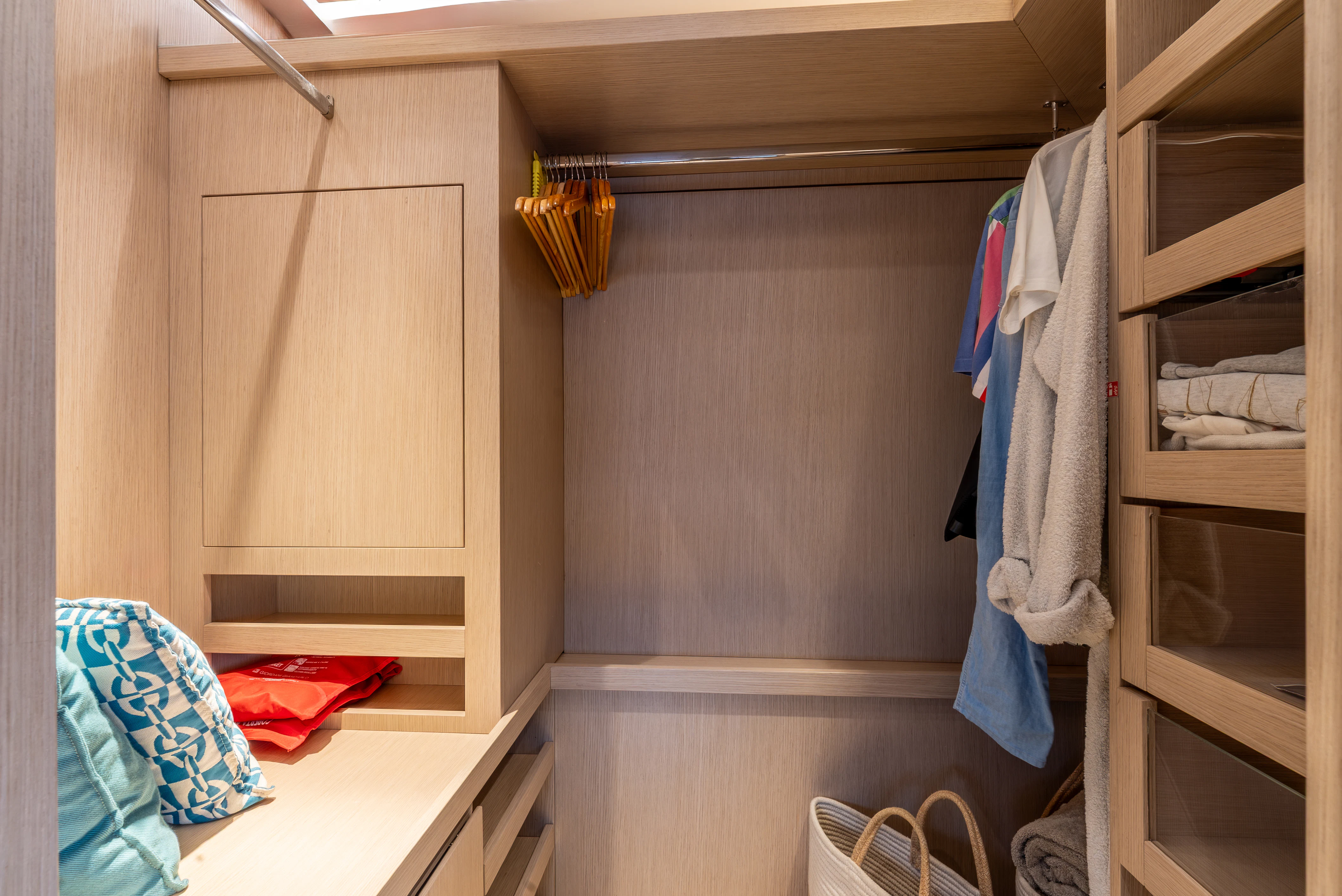 a closet with clothes on the wall aboard ZALANKA Yacht for Sale