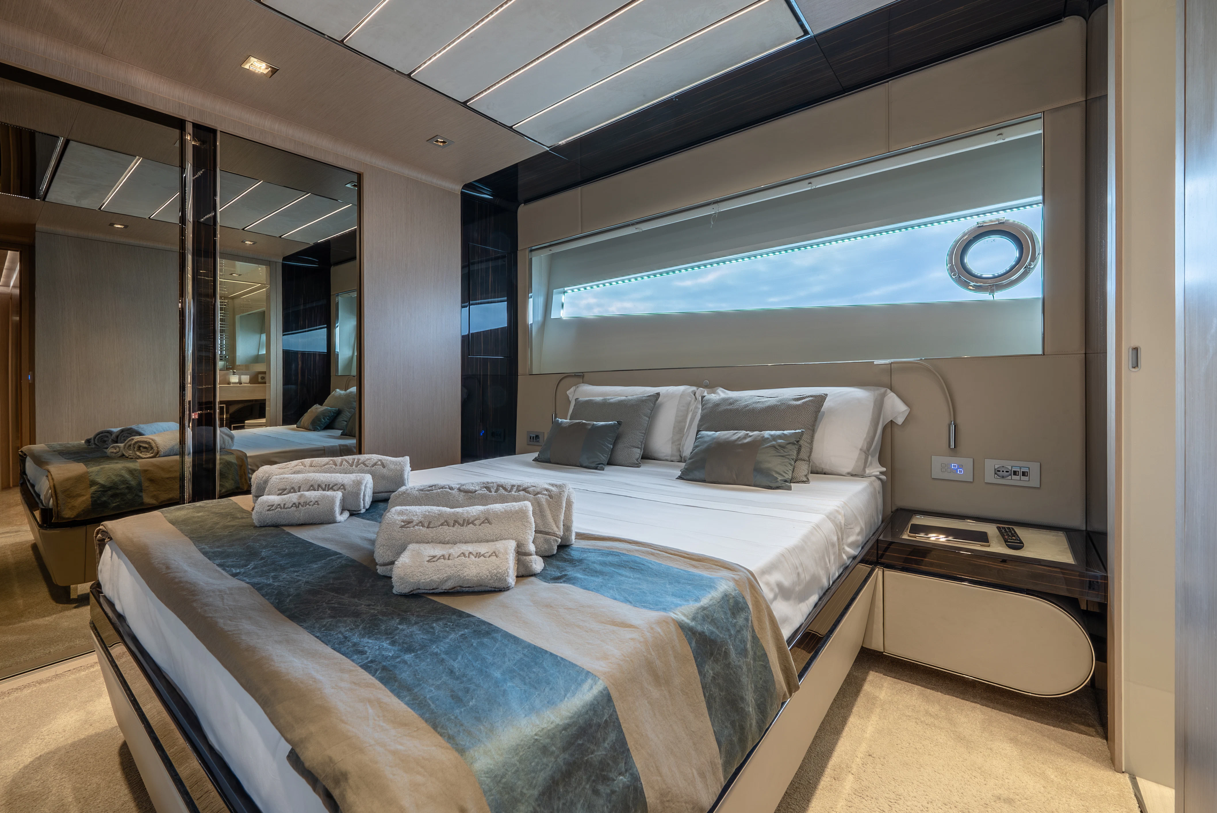 a room with a bed and a mirror aboard ZALANKA Yacht for Sale