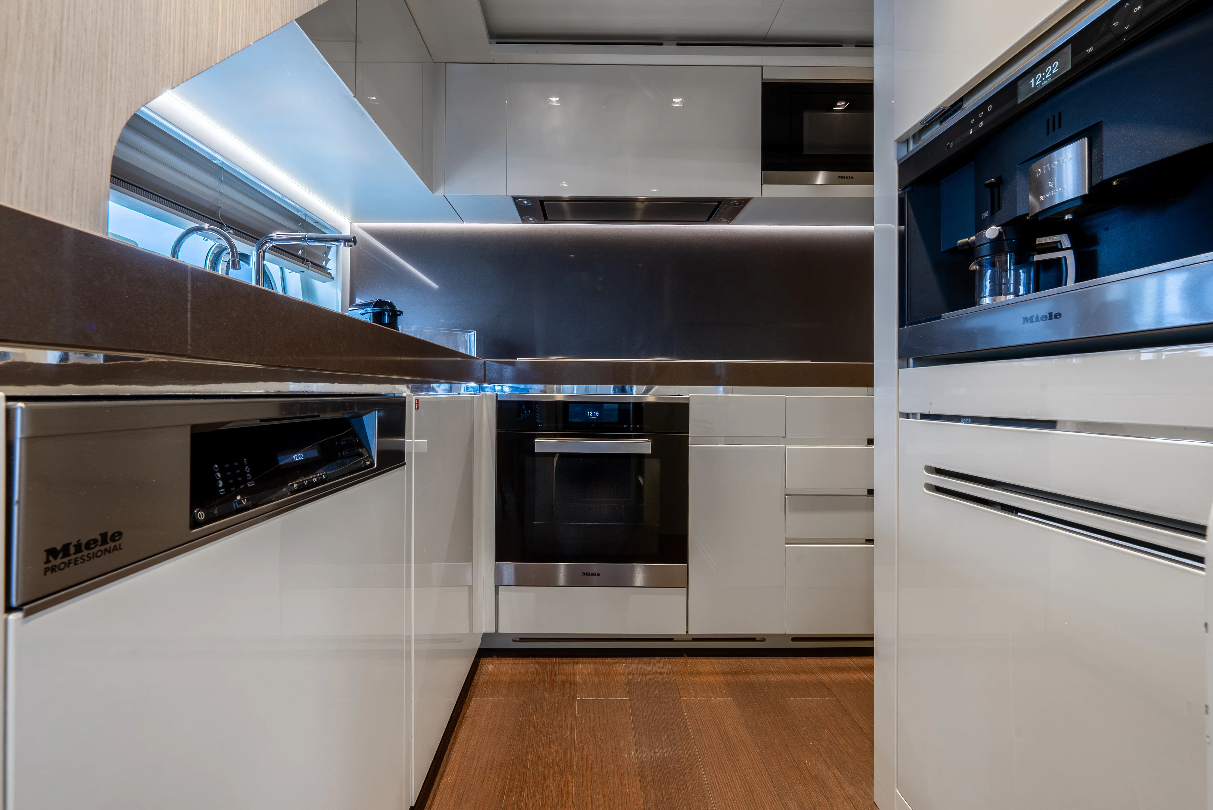a kitchen with white cabinets aboard ZALANKA Yacht for Sale