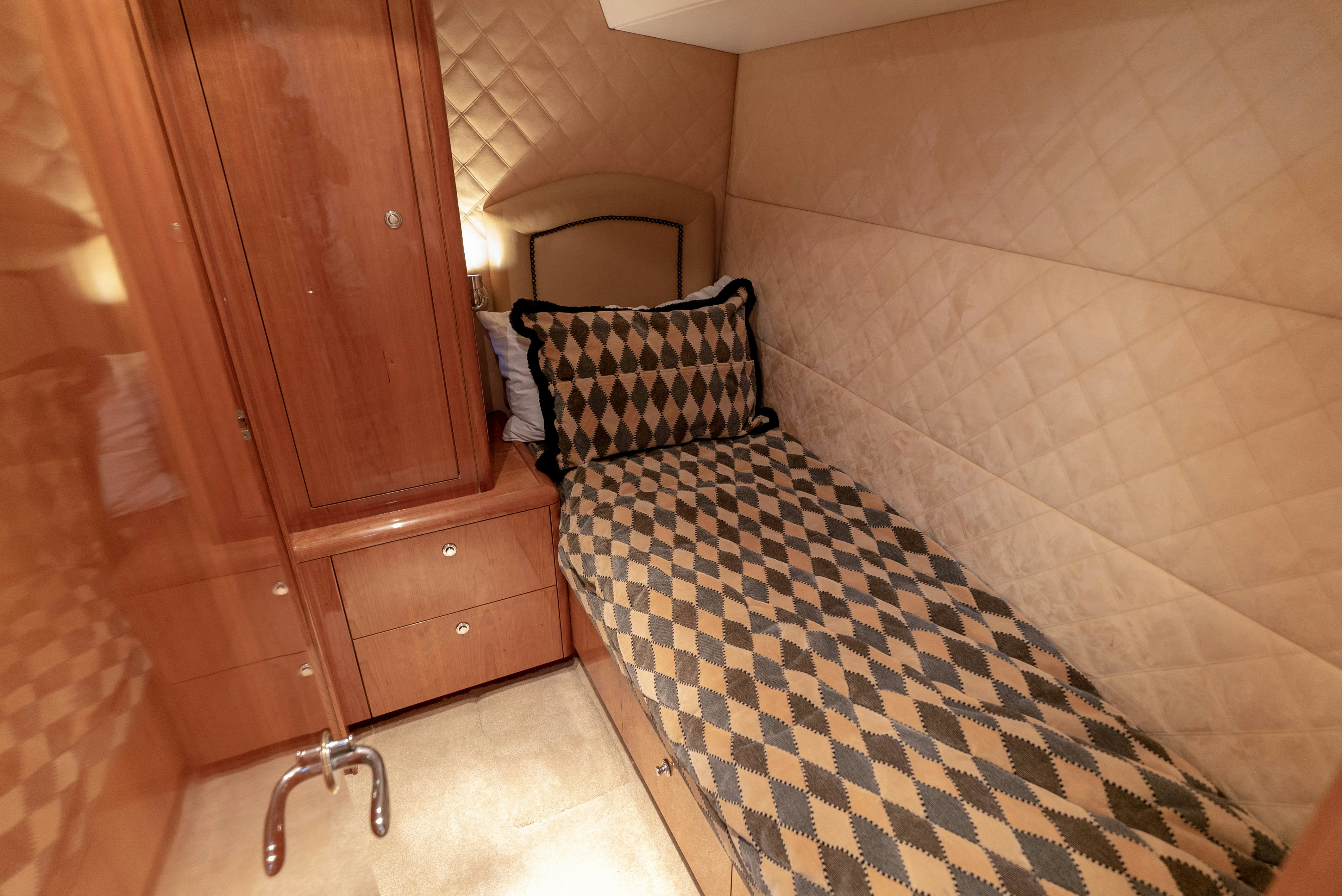a bed in a room aboard SONORA Yacht for Sale