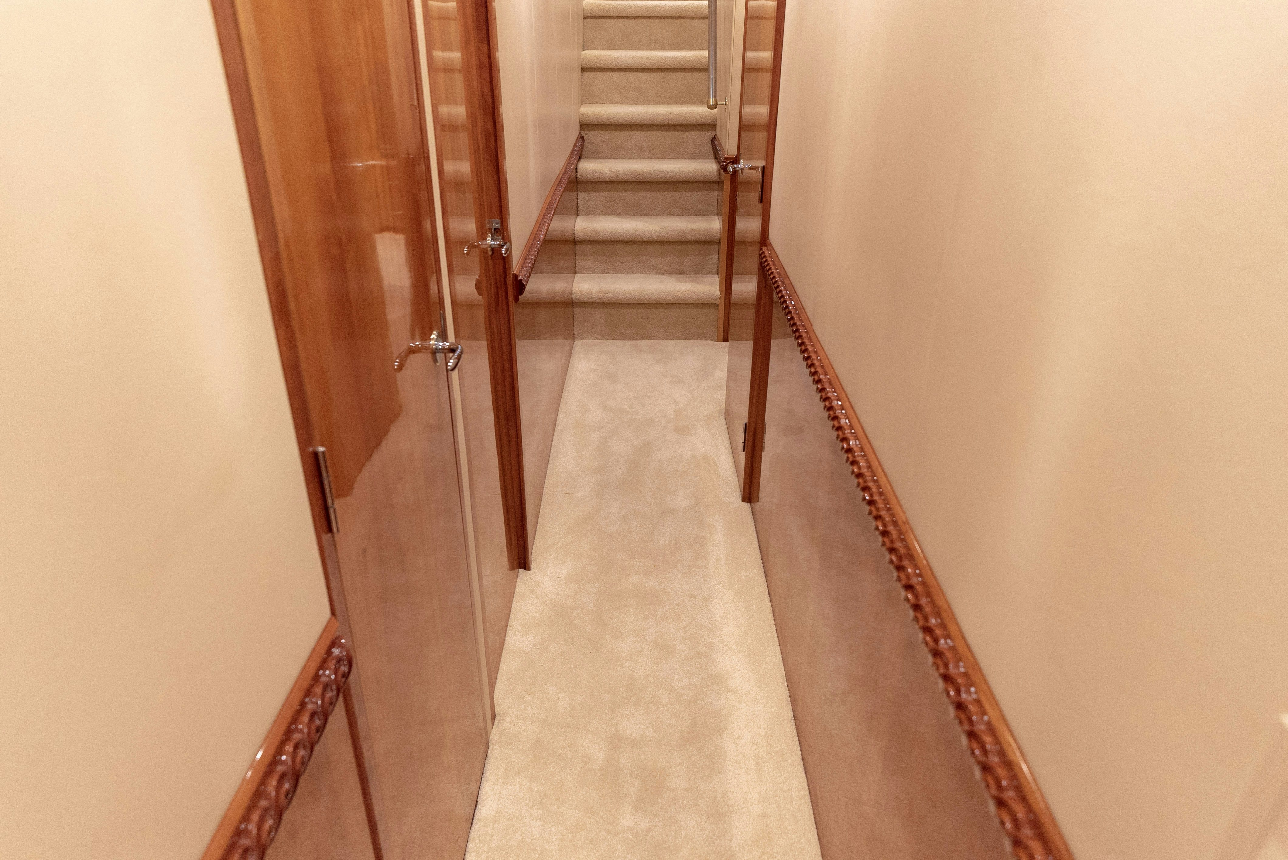 a hallway with a staircase aboard SONORA Yacht for Sale