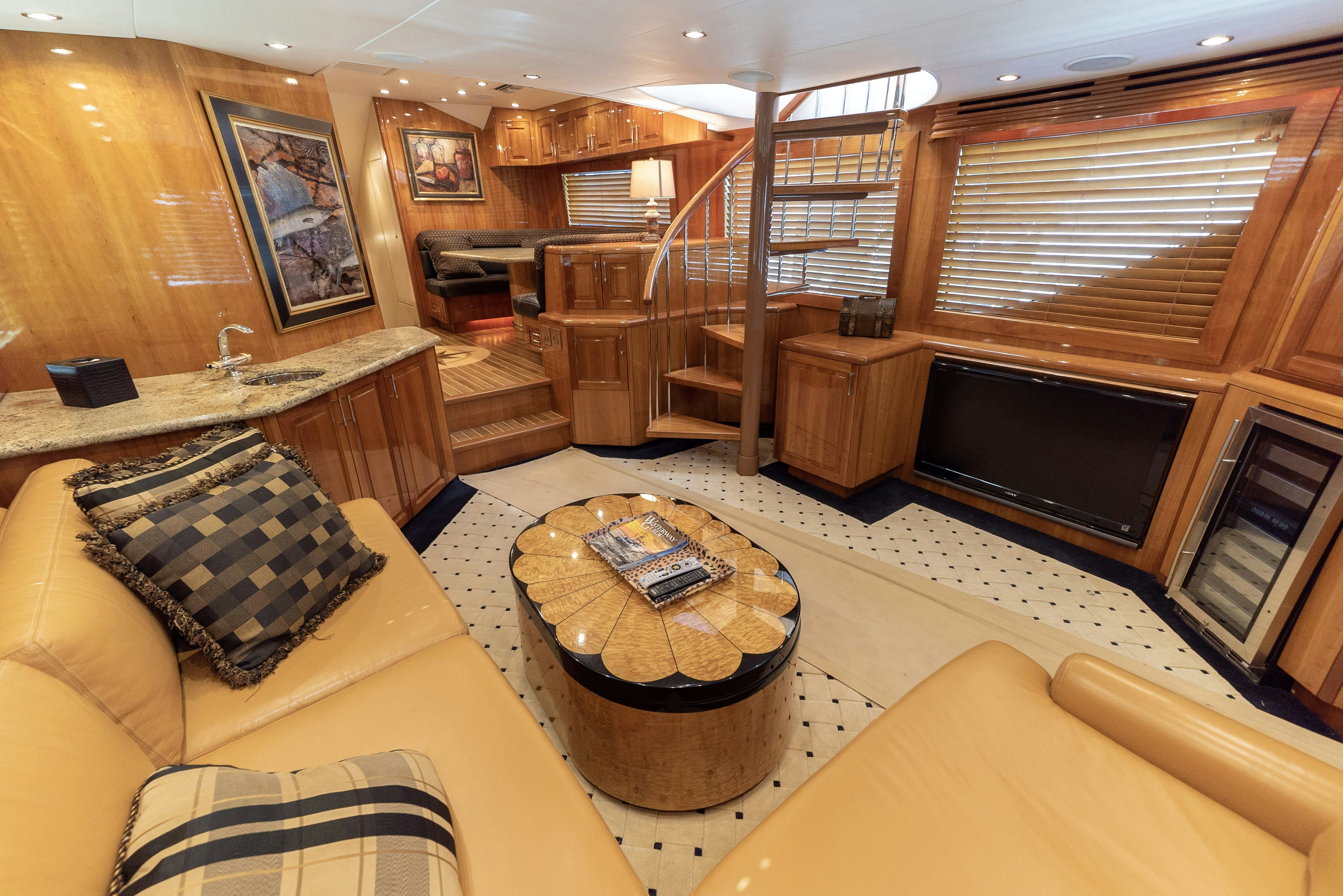 a living room with a fireplace aboard SONORA Yacht for Sale