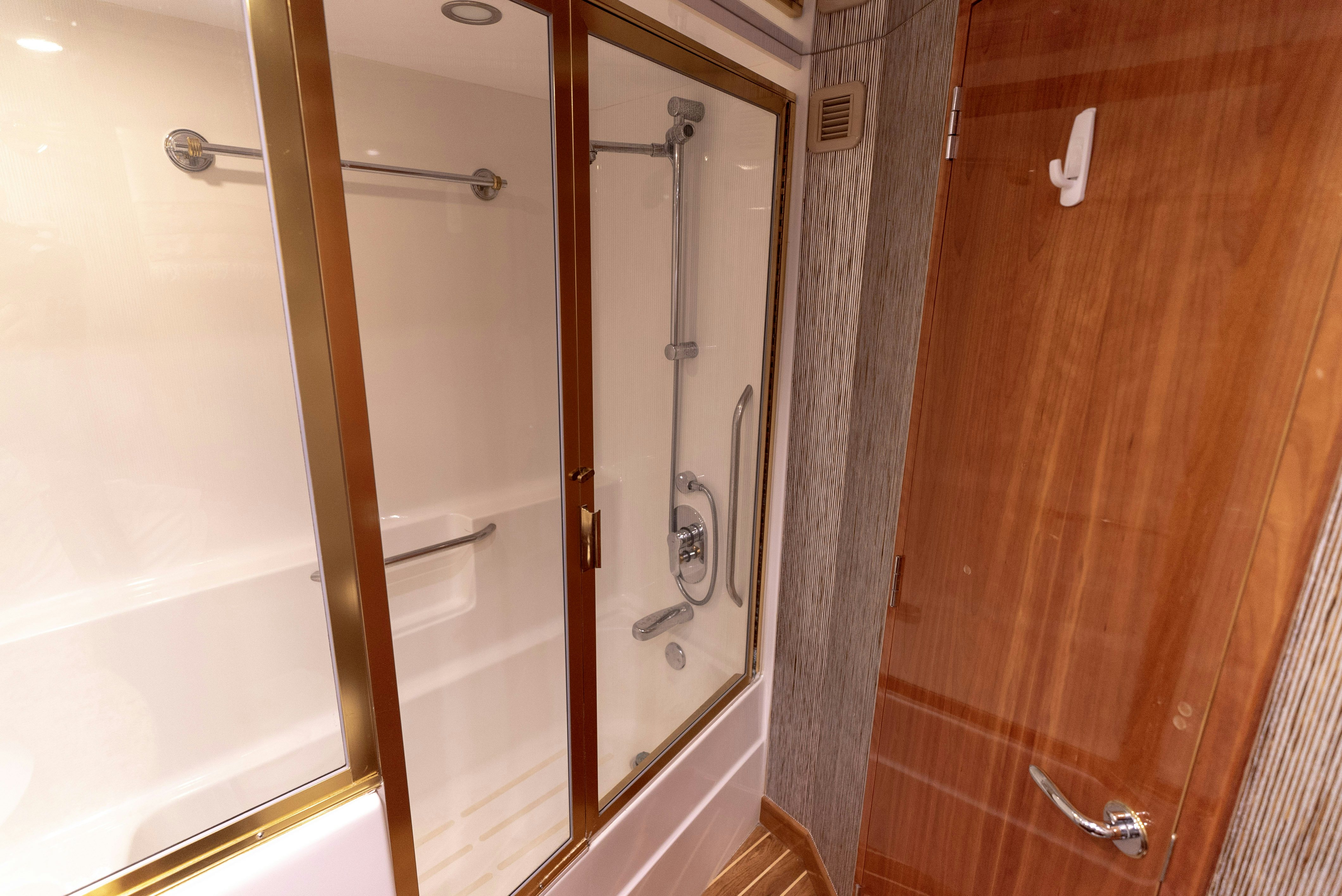 a bathroom with a shower unit and a sink aboard SONORA Yacht for Sale