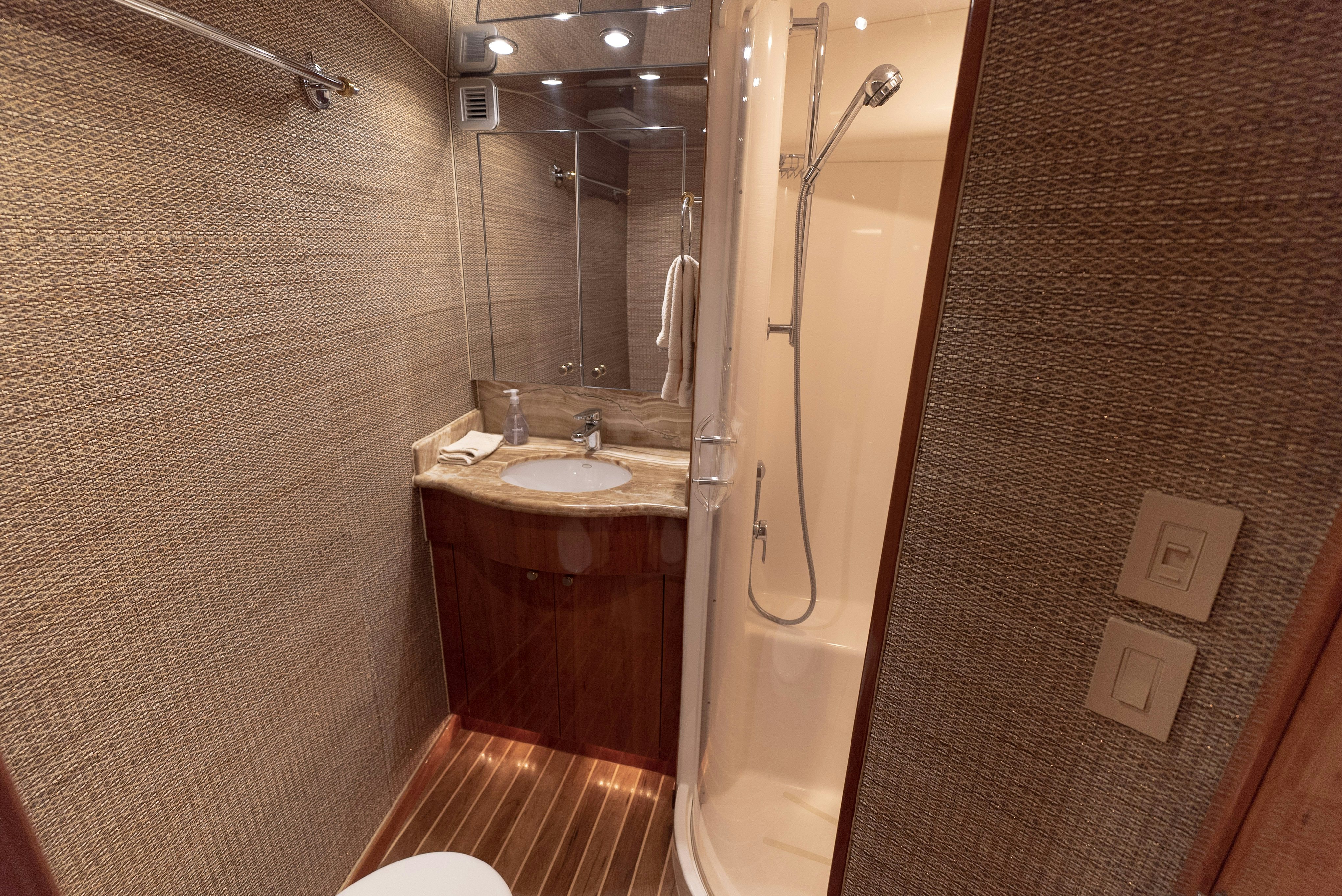 a bathroom with a shower and sink aboard SONORA Yacht for Sale