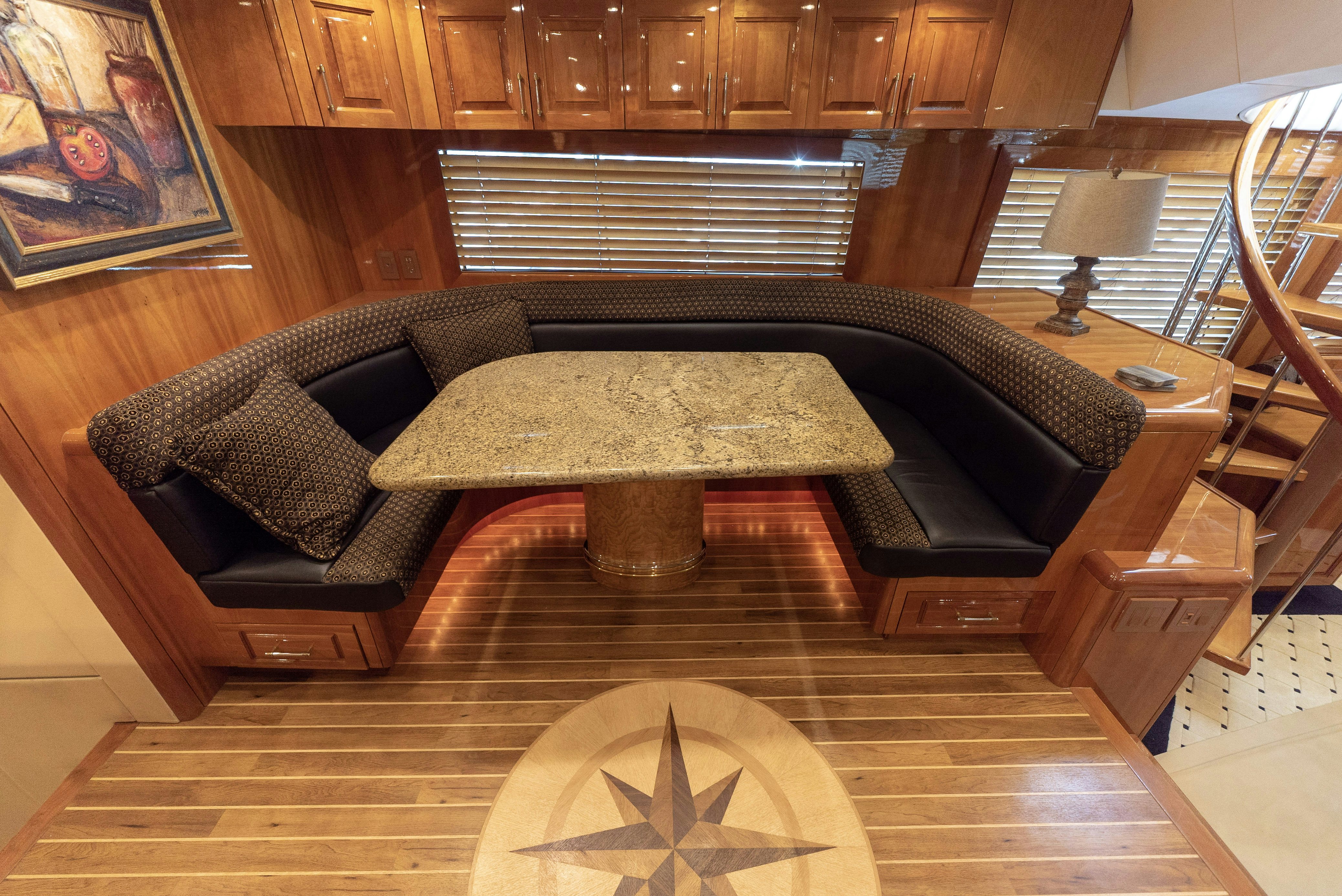 a leather couch in a room aboard SONORA Yacht for Sale