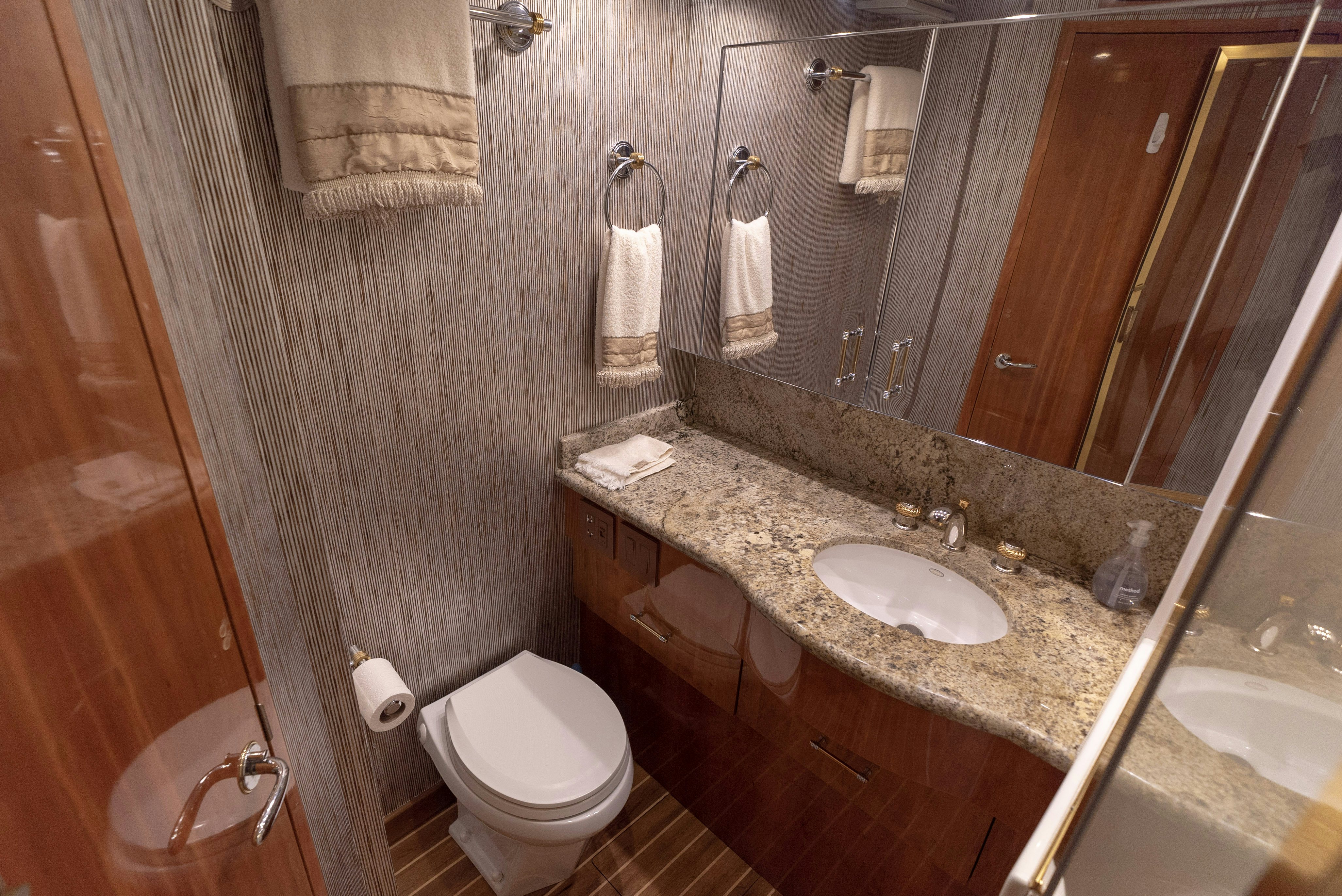 a bathroom with a sink and toilet aboard SONORA Yacht for Sale
