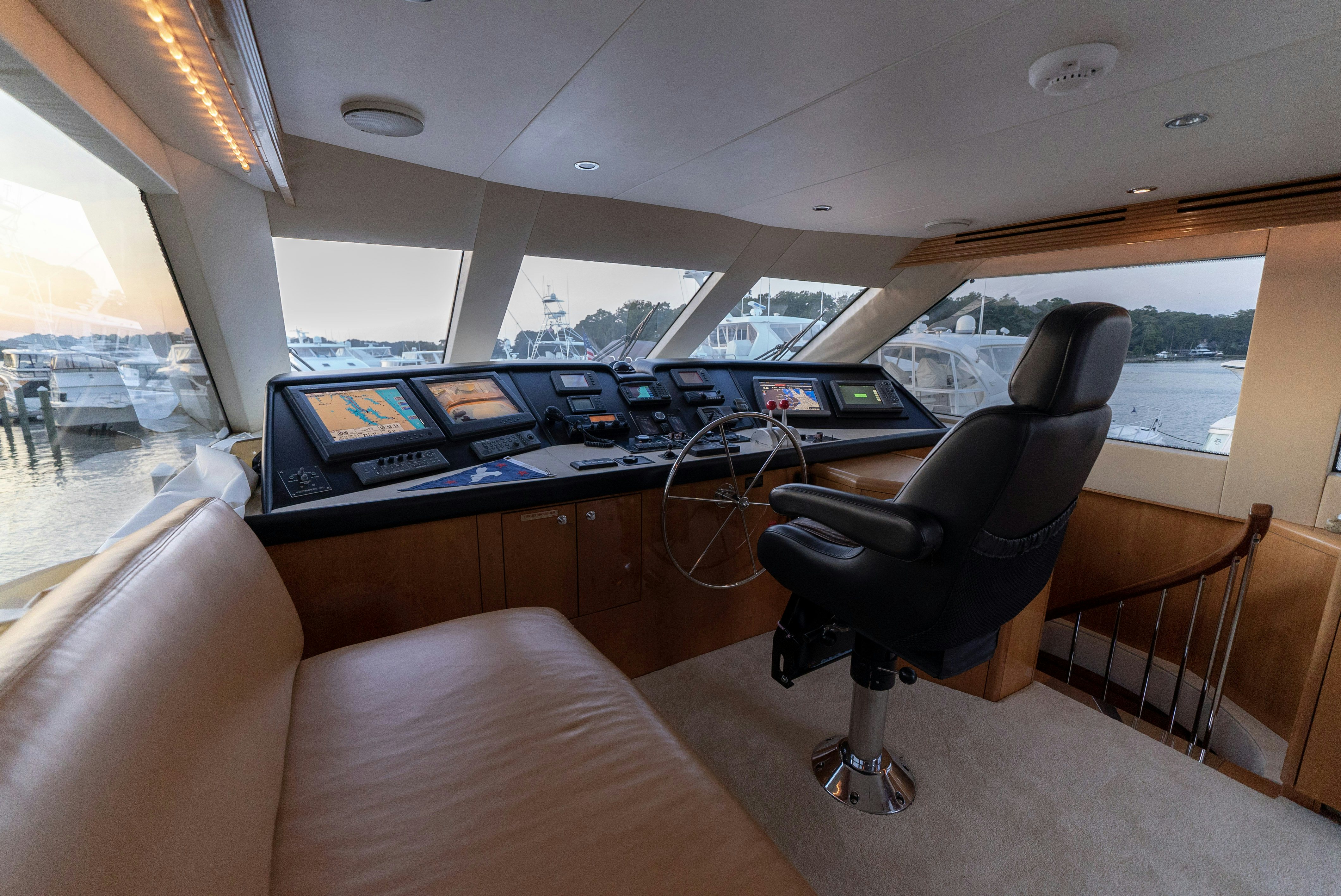 a room with a desk and chairs aboard SONORA Yacht for Sale