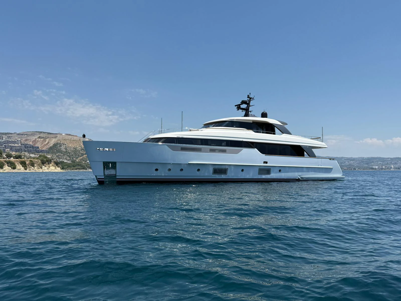 a white yacht in the water aboard AISHA Yacht for Sale