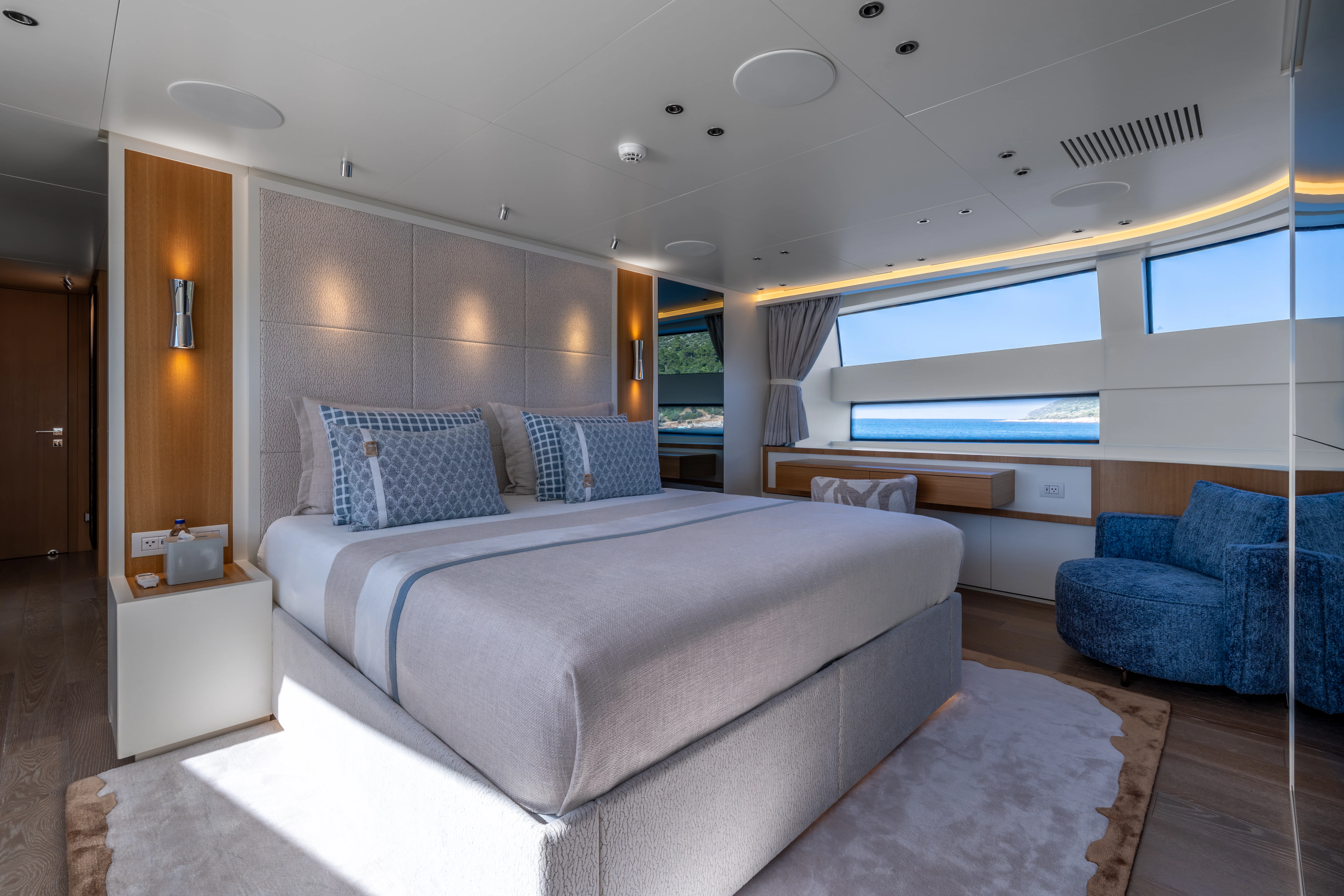 a large bedroom with a large bed aboard AISHA Yacht for Sale