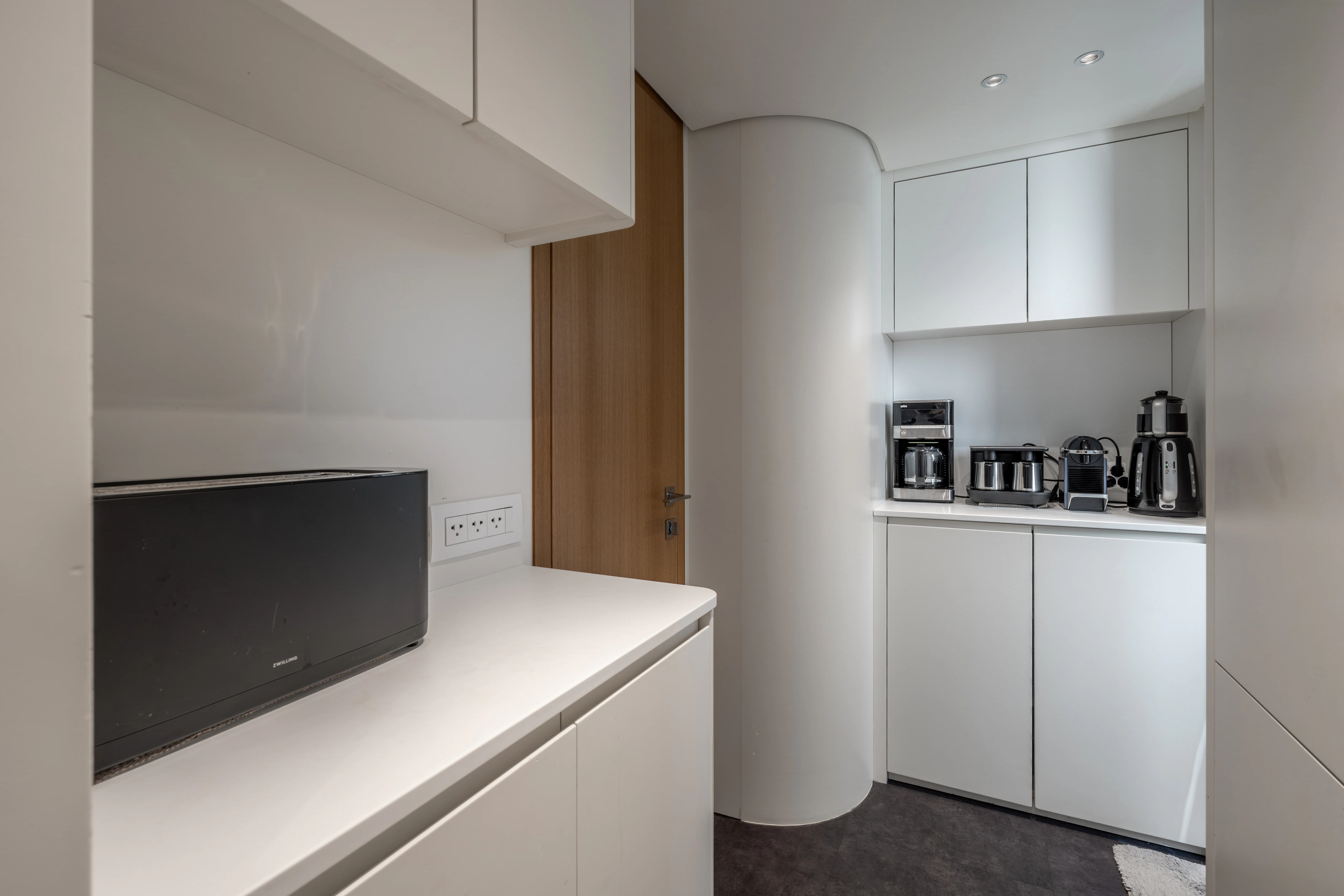 a kitchen with white cabinets aboard AISHA Yacht for Sale