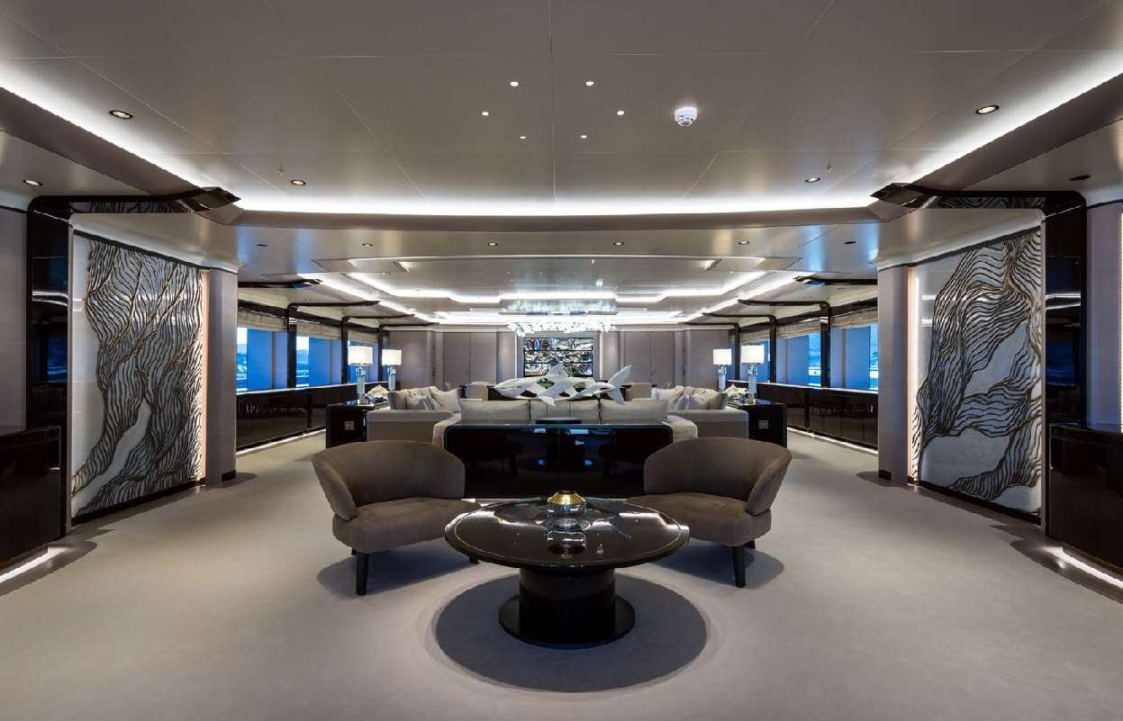 a large room with a couch and a table aboard O'PARI Yacht for Charter