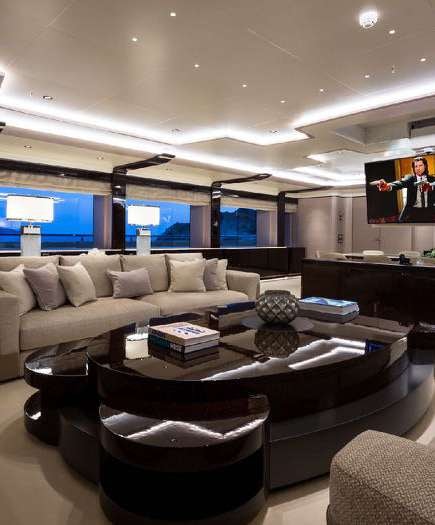a living room with a large sofa aboard O'PARI Yacht for Charter