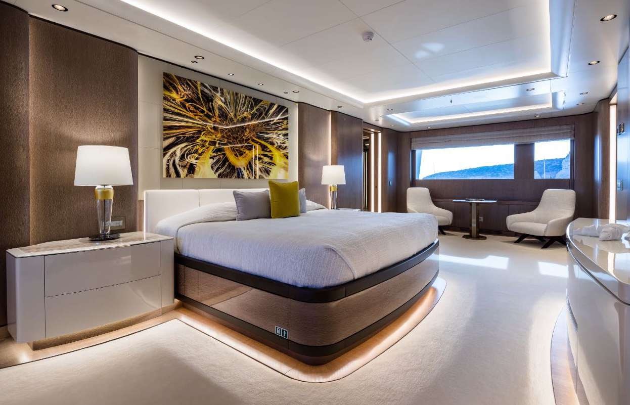 a large bedroom with a large bed aboard O'PARI Yacht for Charter