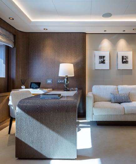 a hotel room with a bed and a couch aboard O'PARI Yacht for Charter