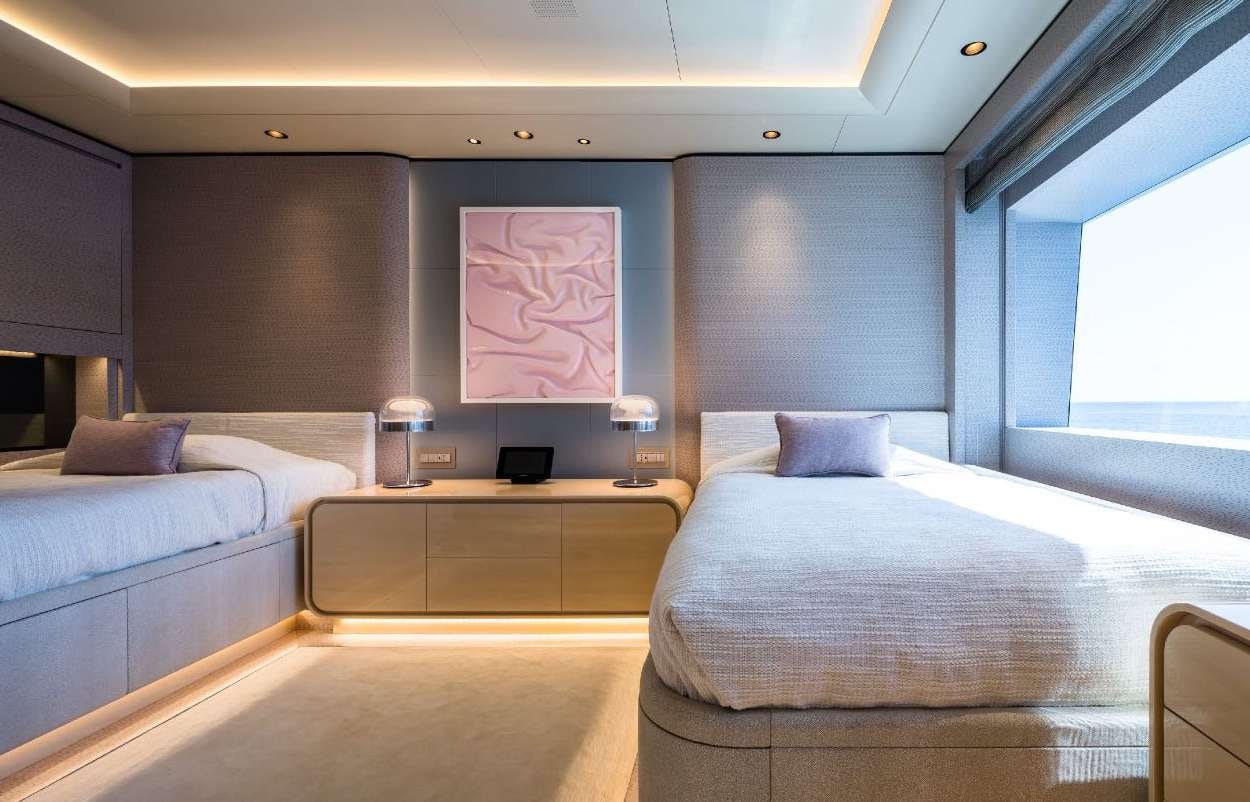 a room with two beds aboard O'PARI Yacht for Charter