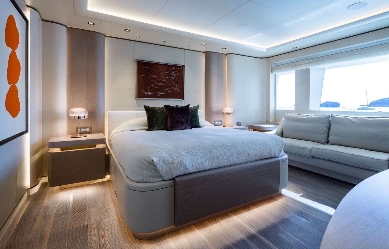 a bed in a room aboard O'PARI Yacht for Charter