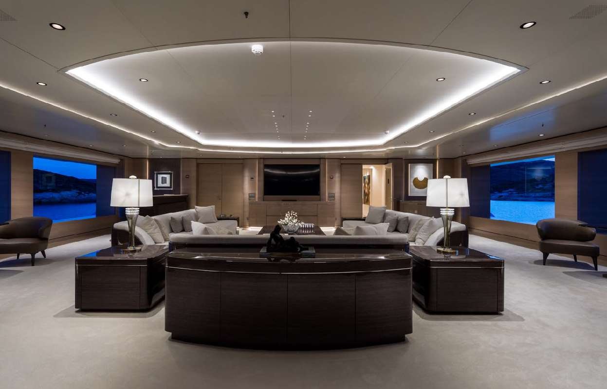 a large living room with a large screen aboard O'PARI Yacht for Charter
