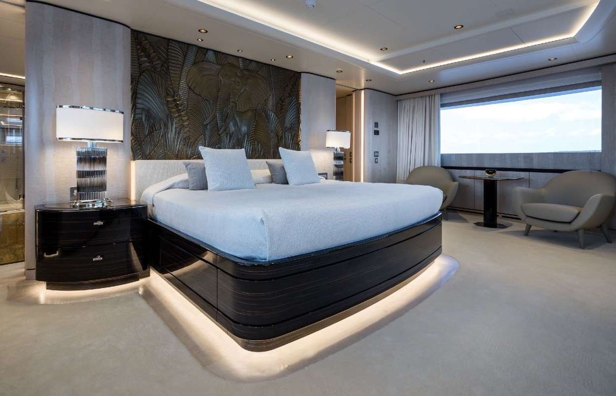 a large bed in a room aboard O'PARI Yacht for Charter