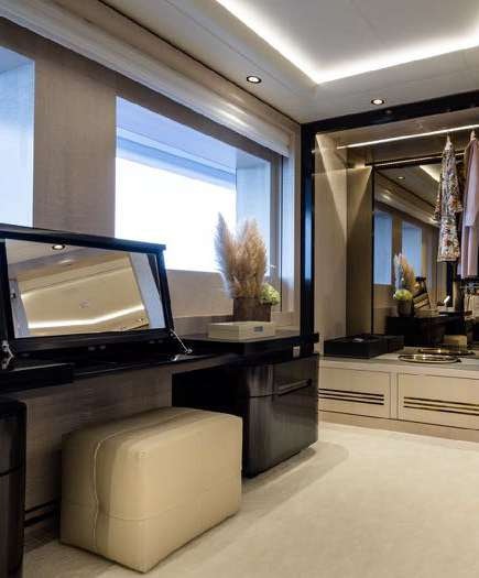 a living room with a tv and a couch aboard O'PARI Yacht for Charter
