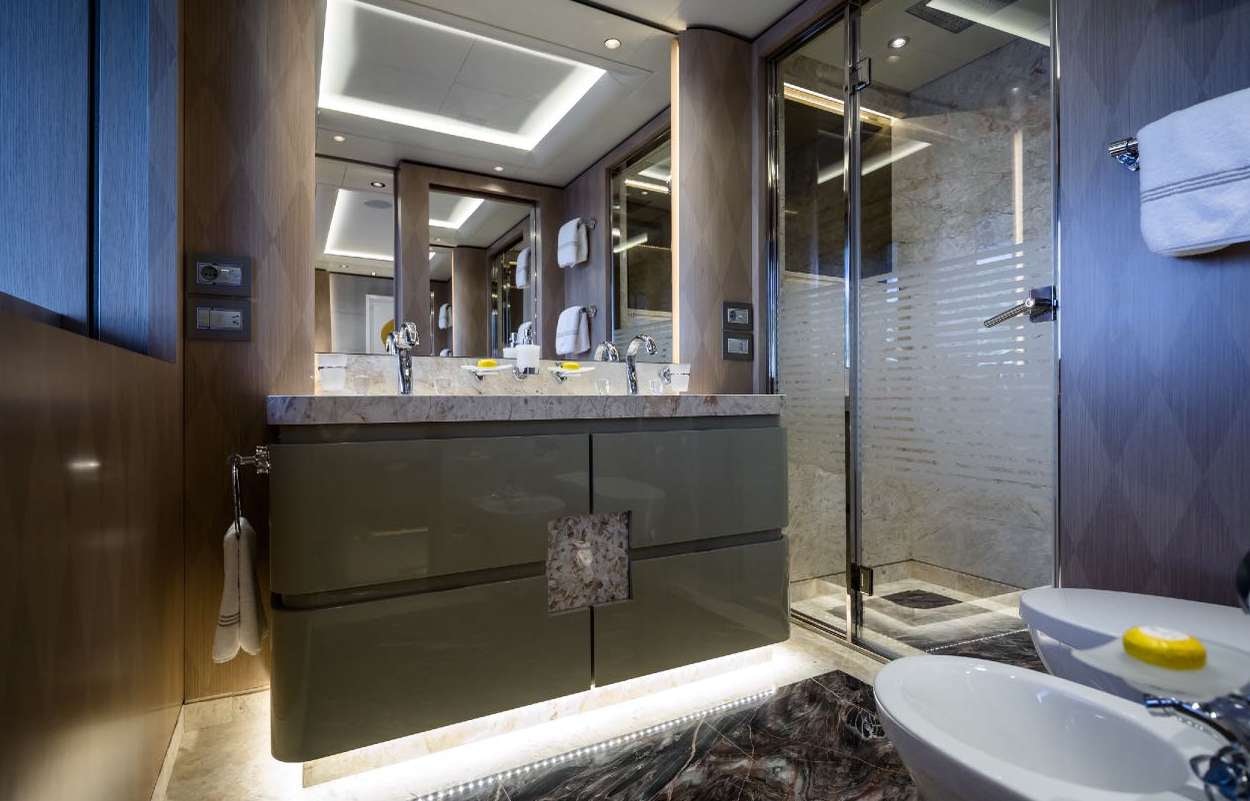 a bathroom with a large mirror aboard O'PARI Yacht for Charter