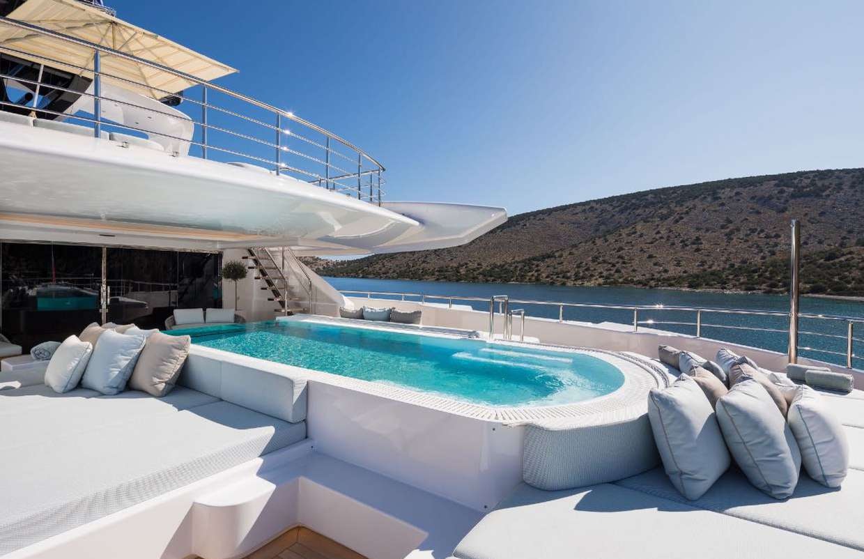 a pool with pillows on a deck aboard O'PARI Yacht for Charter