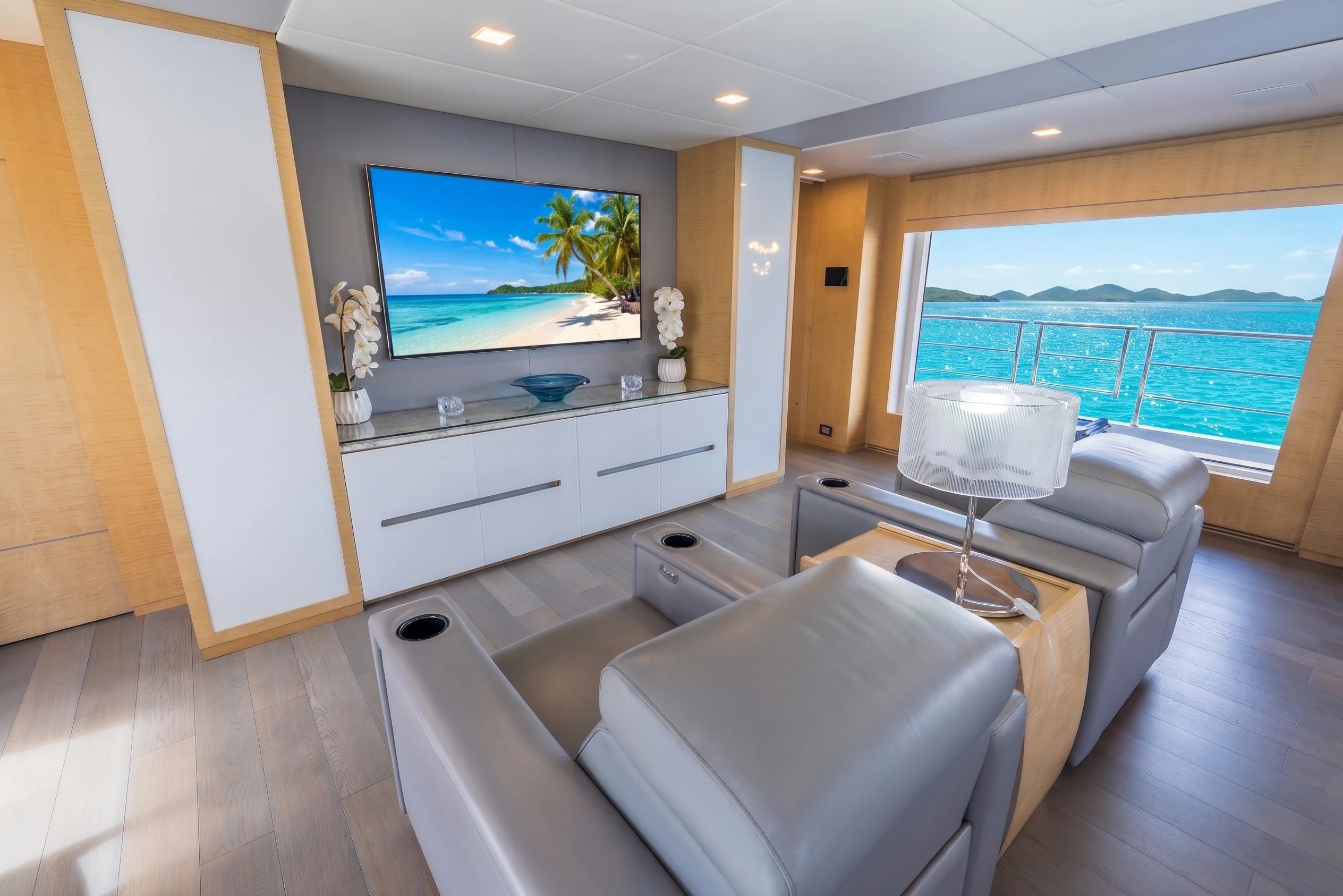 a living room with a tv and a couch aboard 'H Yacht for Charter