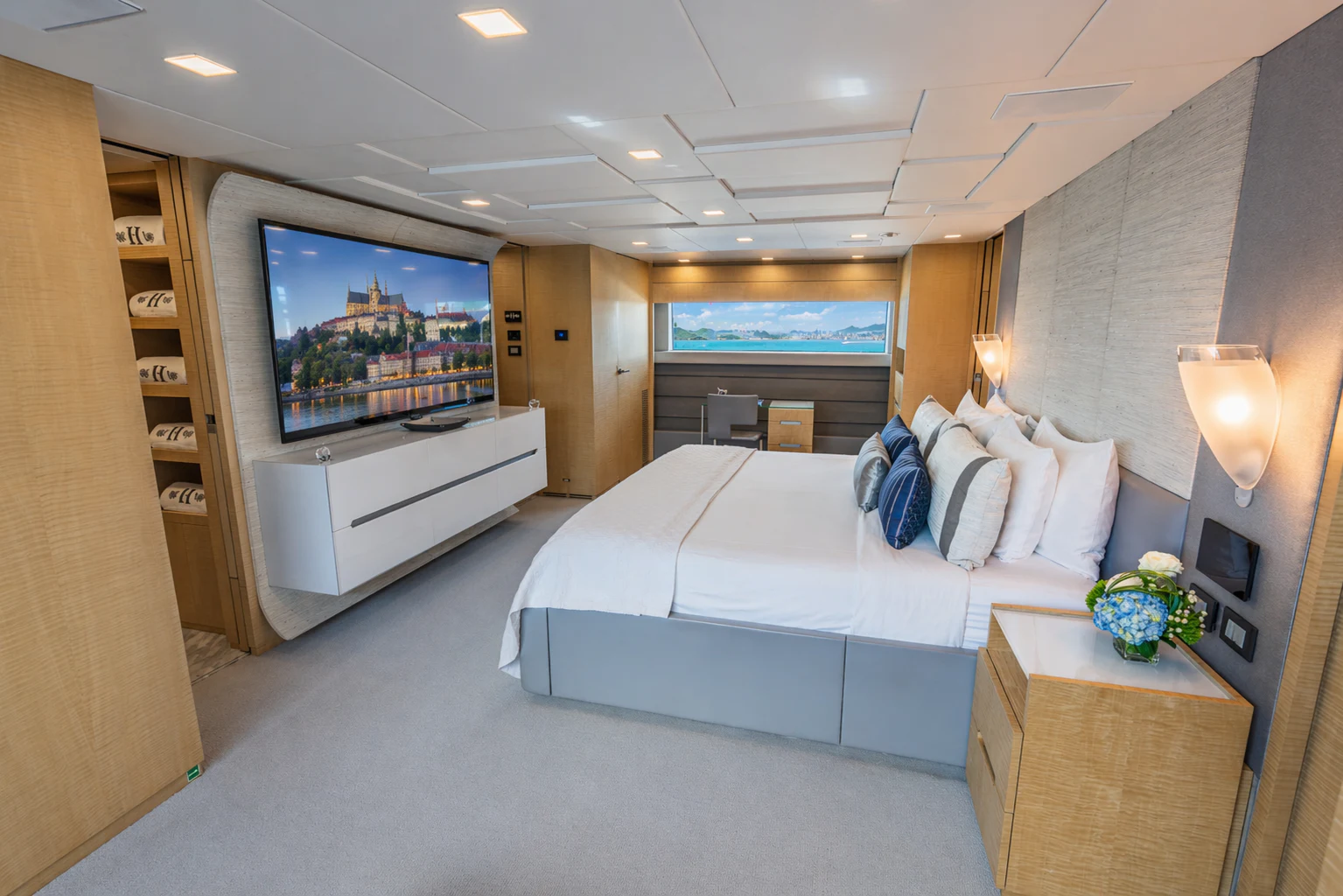 a bedroom with a large bed aboard 'H Yacht for Charter