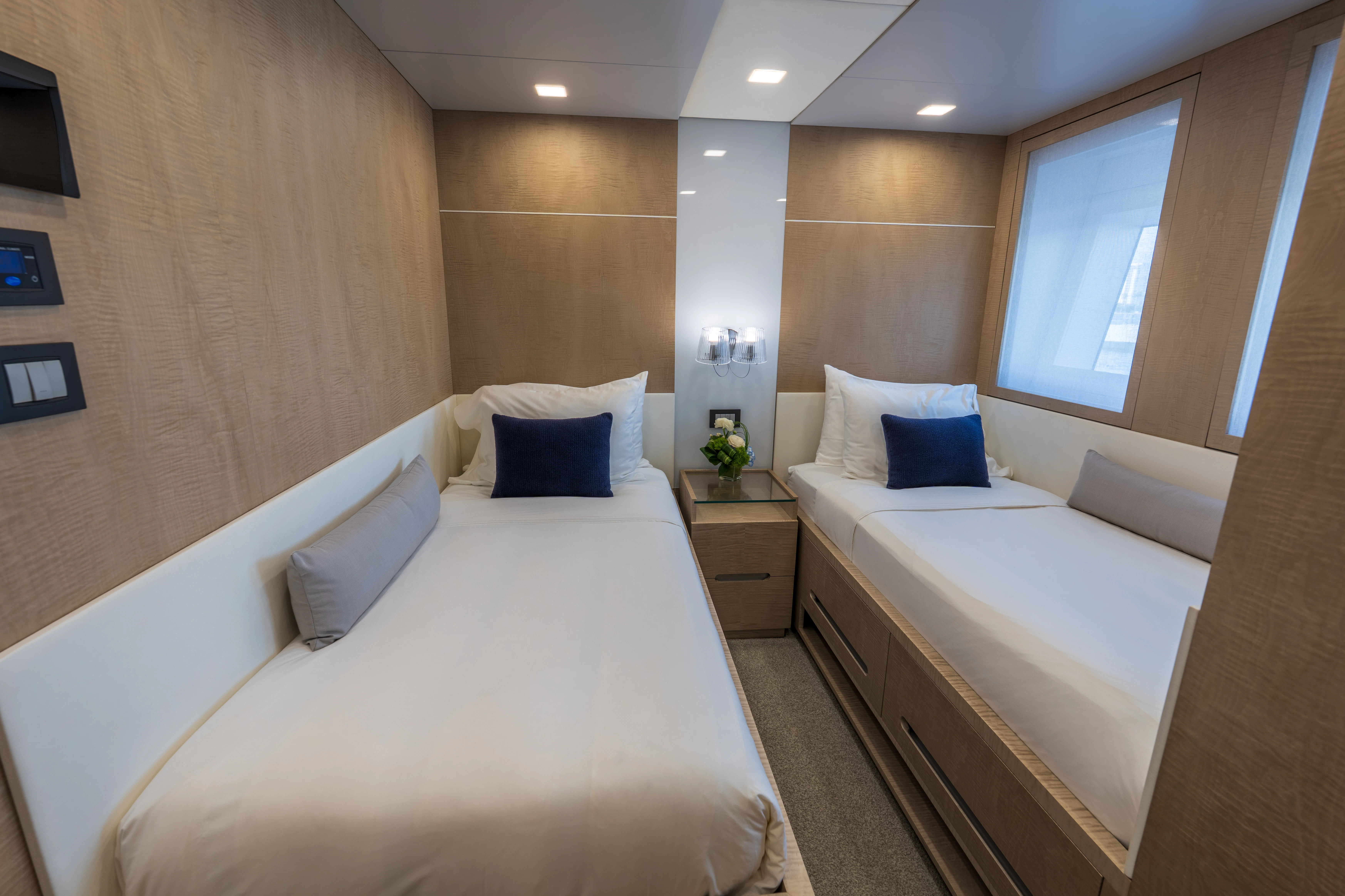 a room with two beds aboard 'H Yacht for Charter