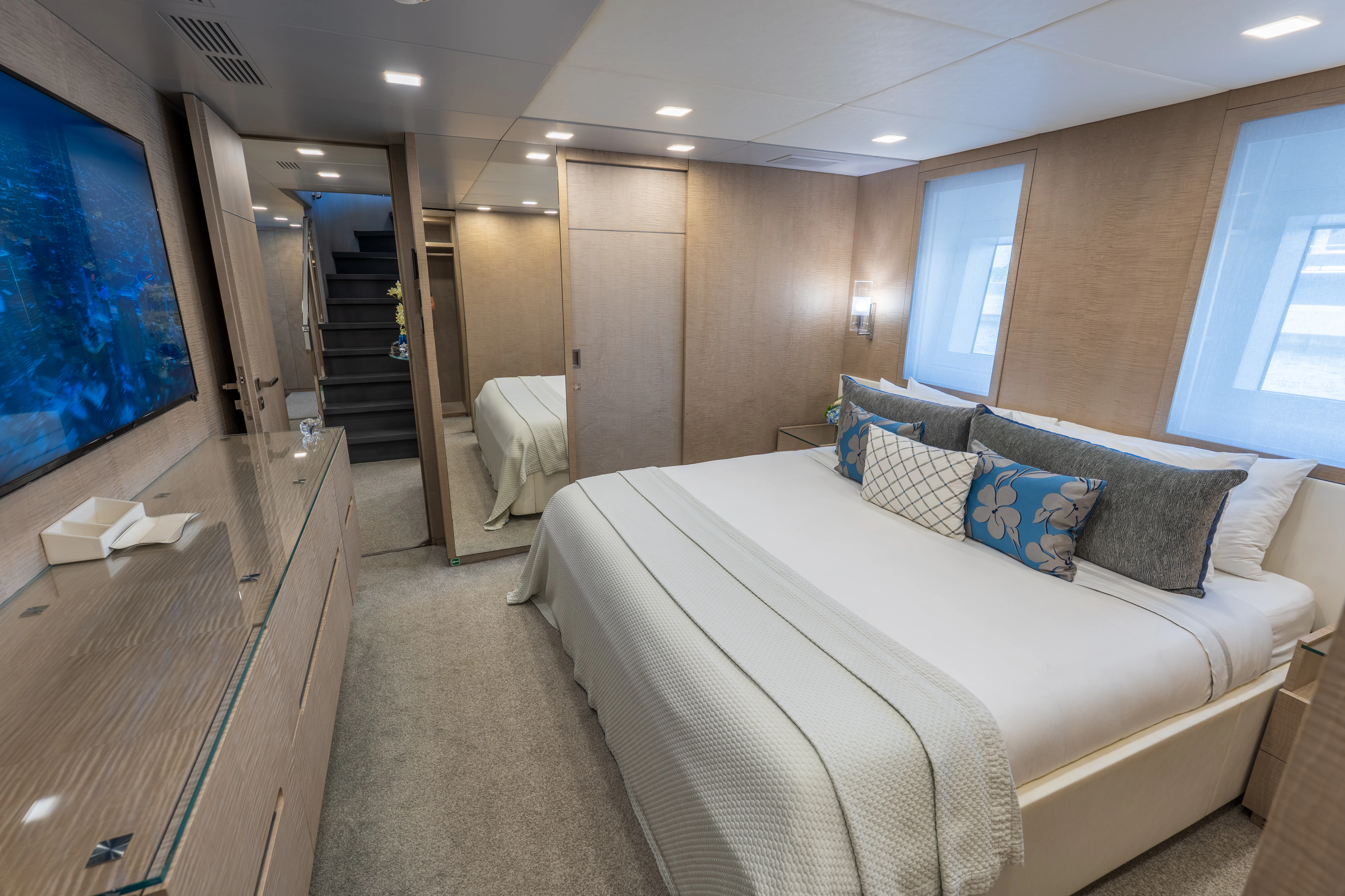 a large bedroom with a large bed aboard 'H Yacht for Charter