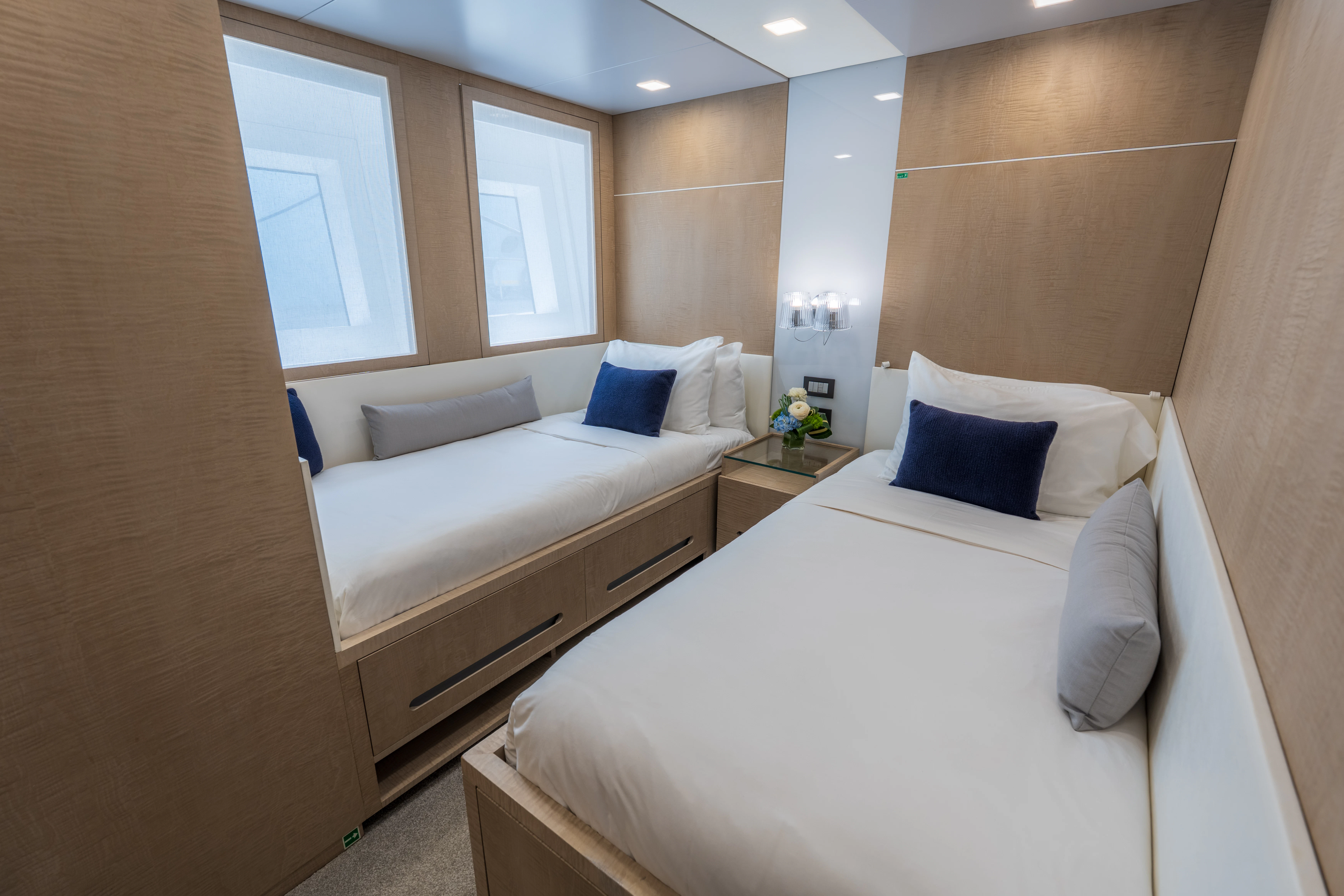 a room with two beds aboard 'H Yacht for Charter