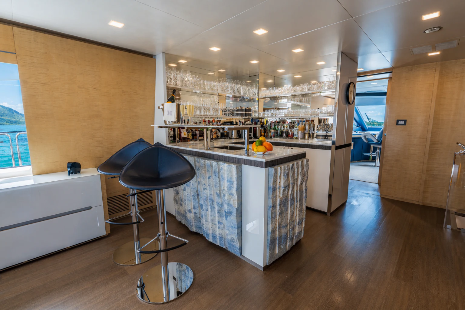 a kitchen with a bar stool aboard 'H Yacht for Charter