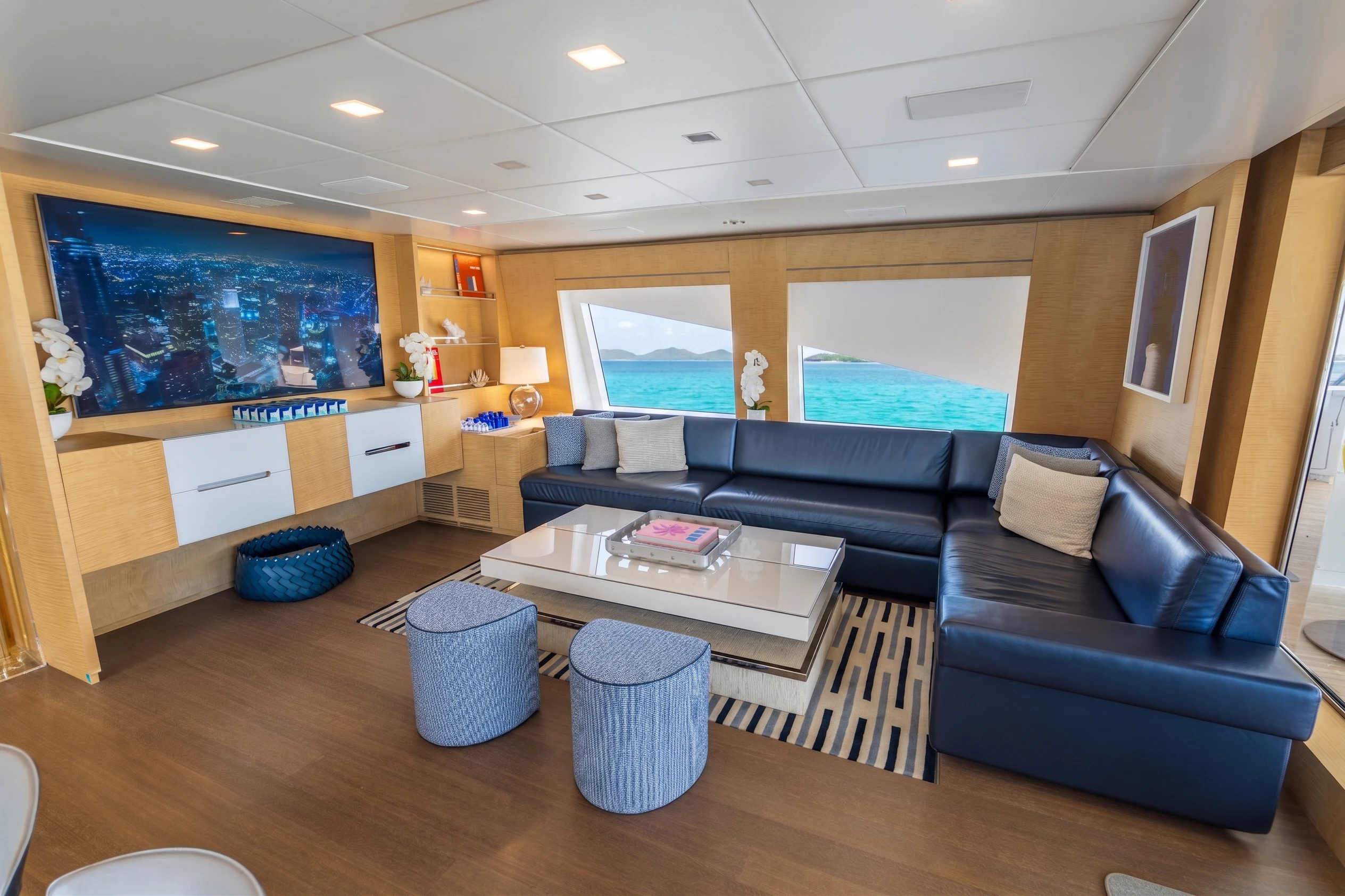 a living room with a couch and a table aboard 'H Yacht for Charter