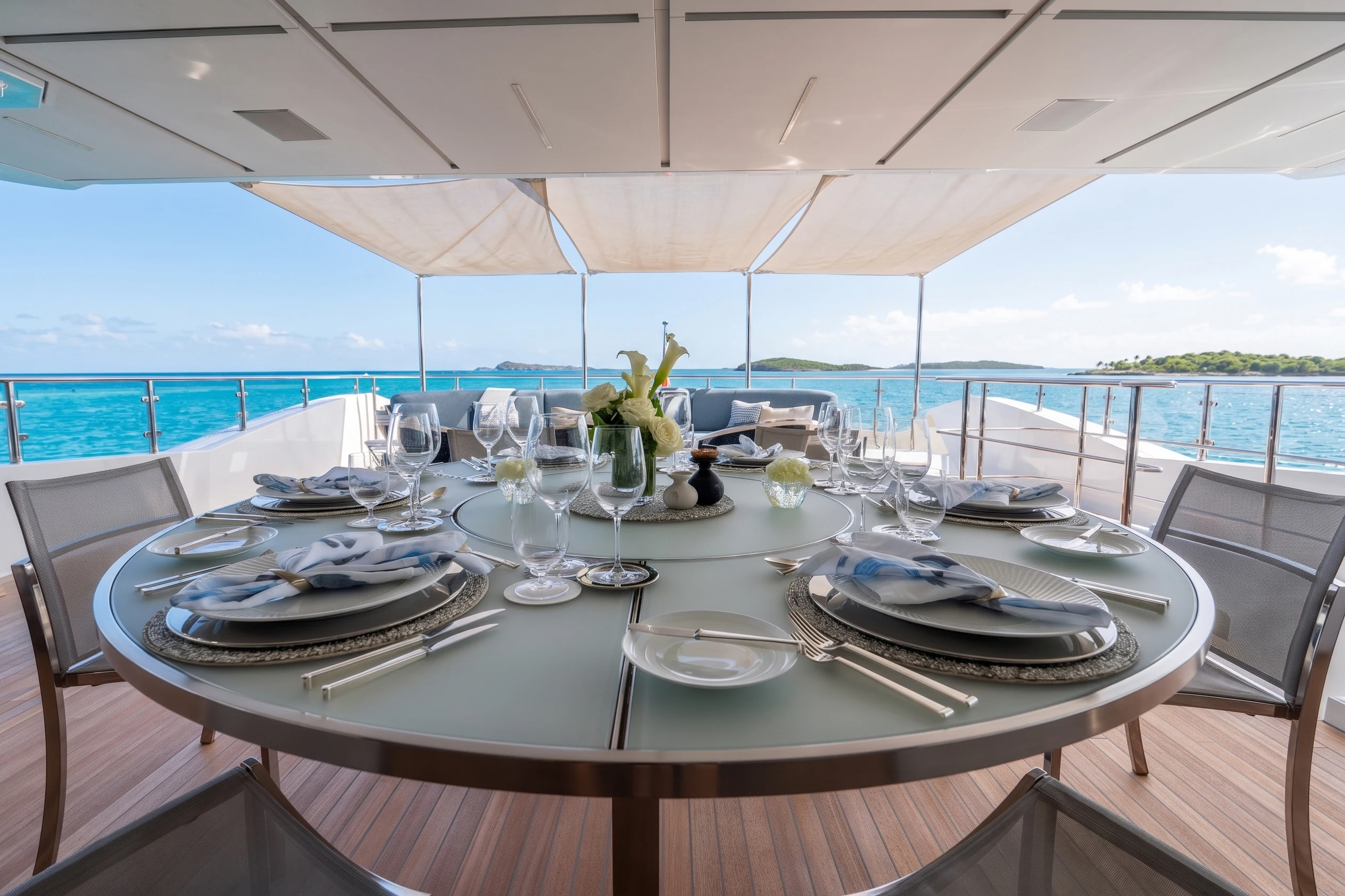 a table set for a dinner aboard 'H Yacht for Charter