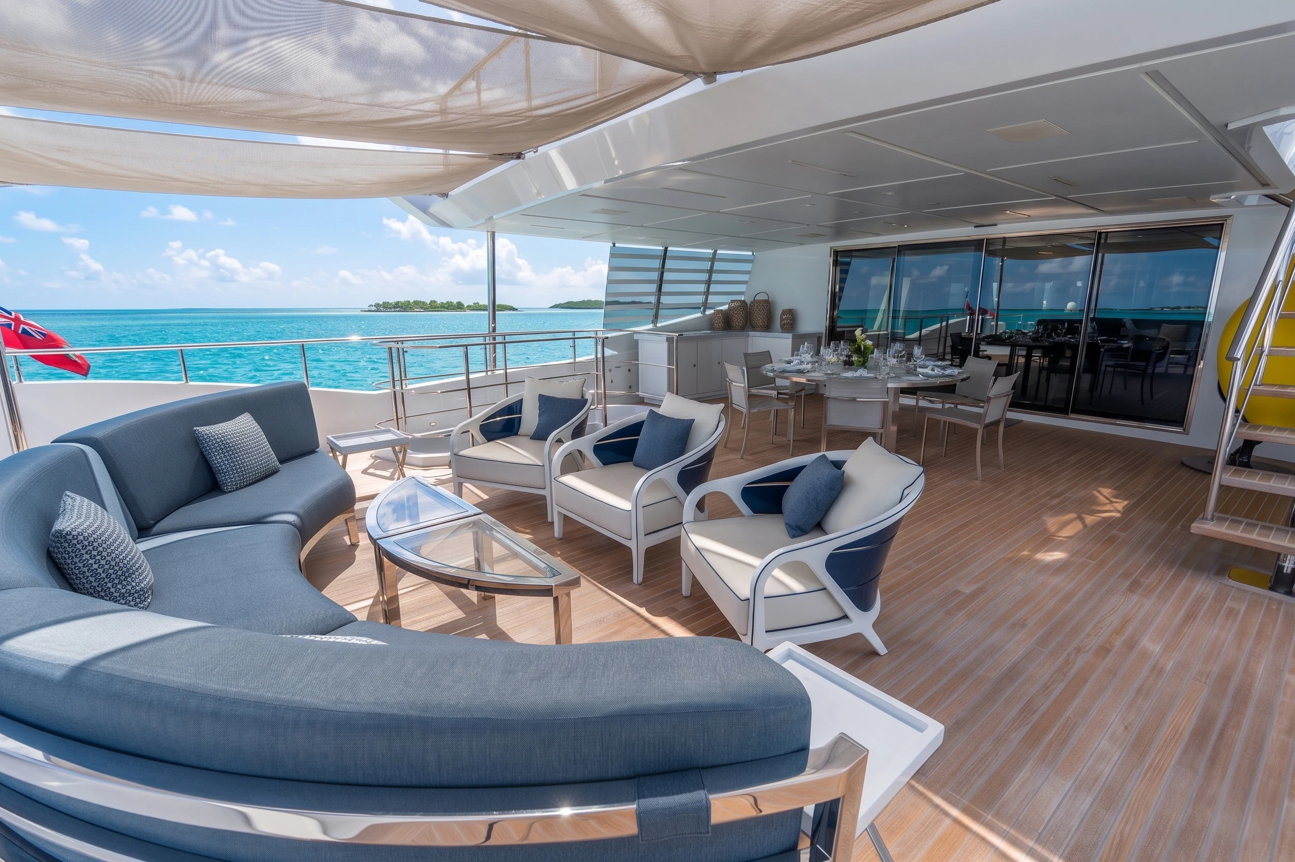 a living room with a large balcony aboard 'H Yacht for Charter