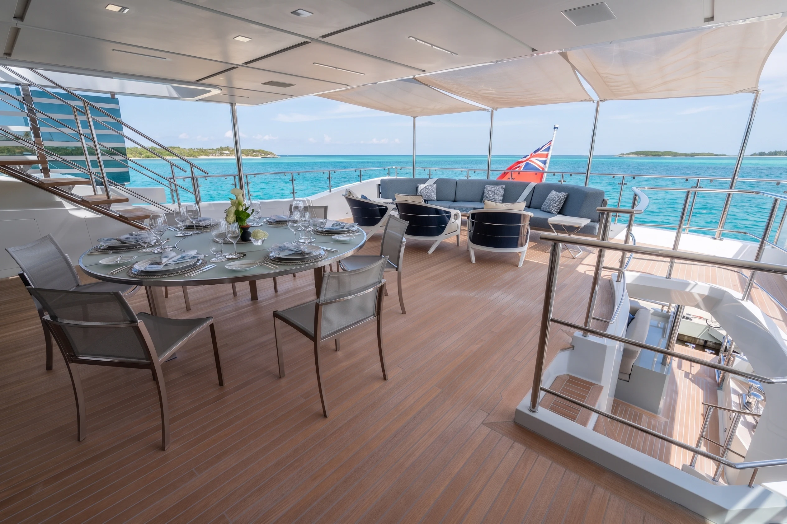 a room with a table and chairs aboard 'H Yacht for Charter