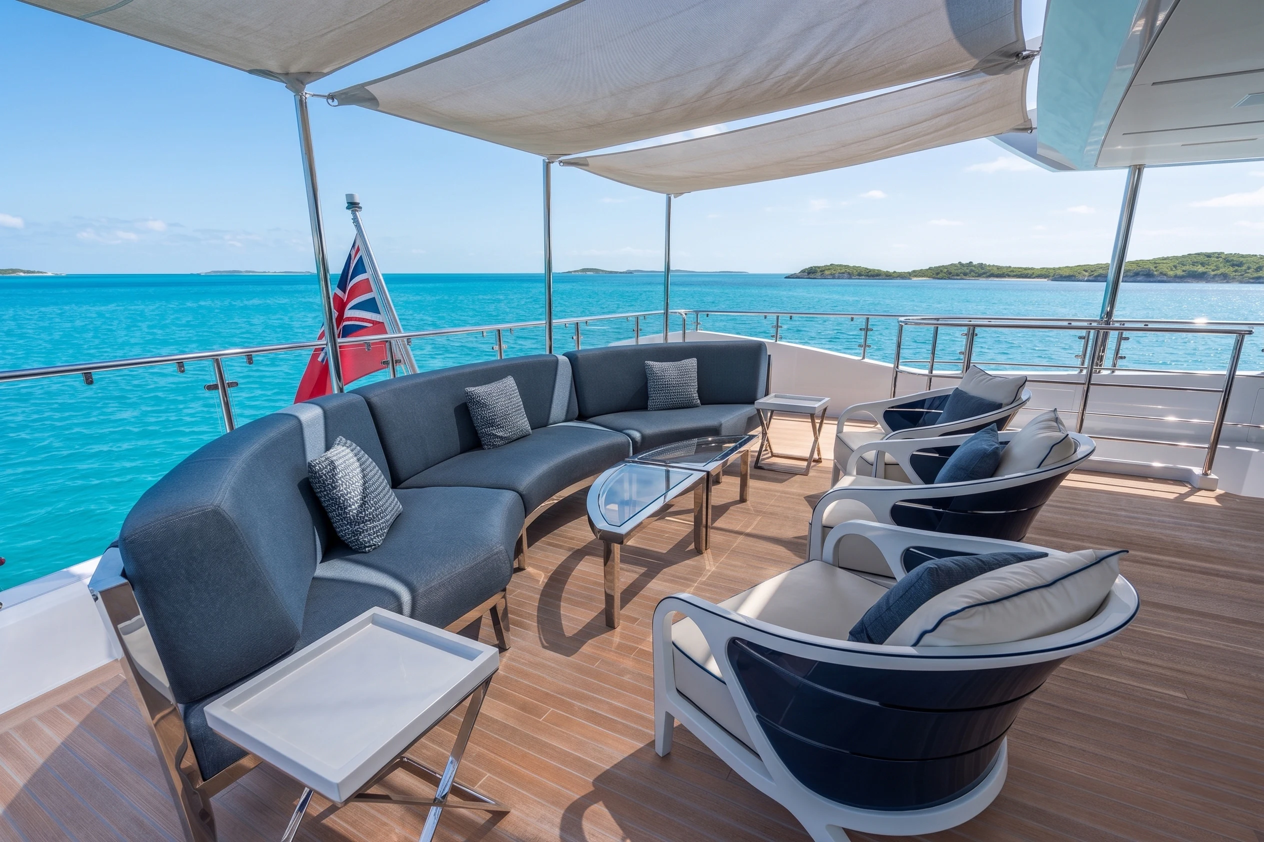 a large living room with a view of the ocean aboard 'H Yacht for Charter