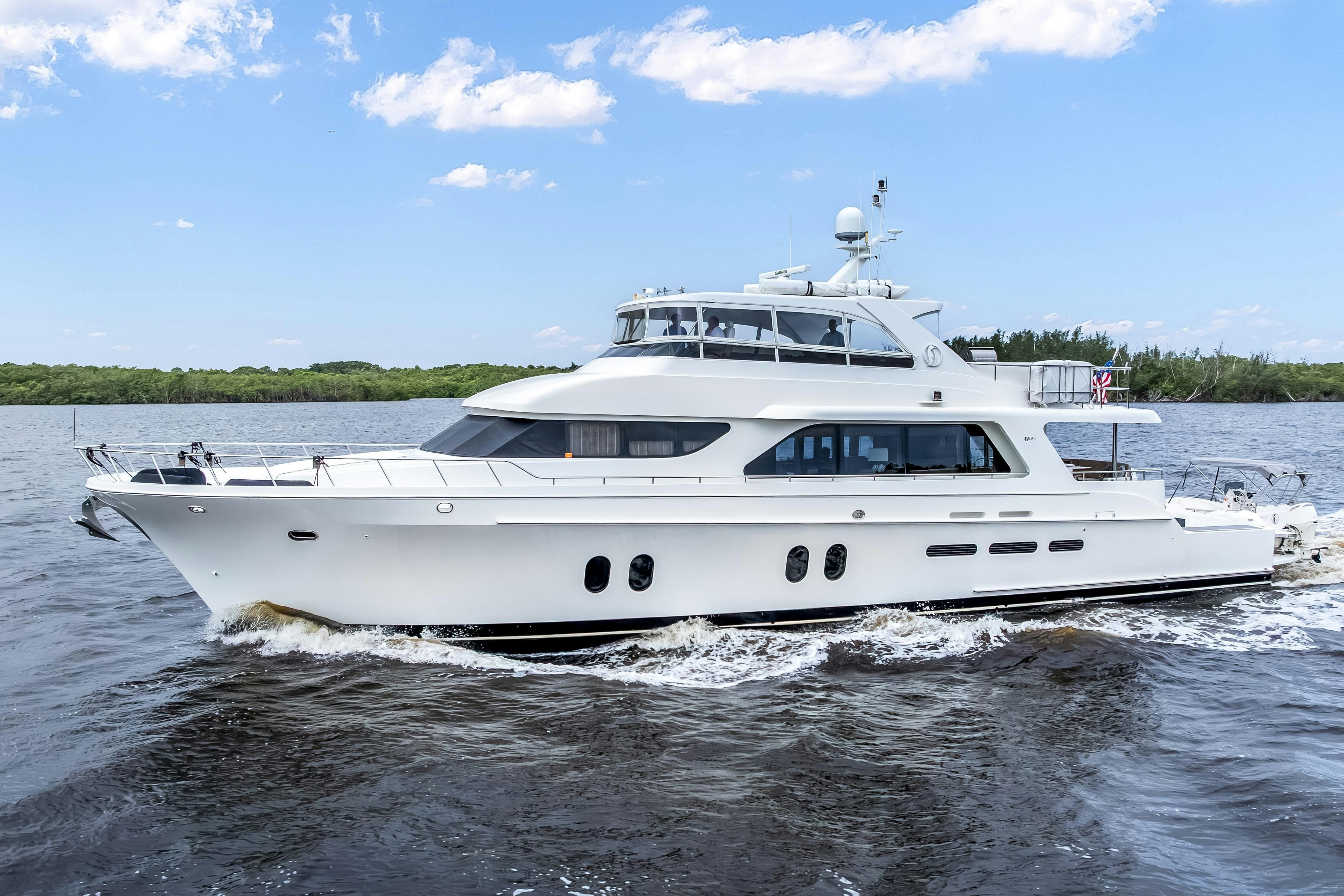 a white boat on water aboard AURORA Yacht for Sale