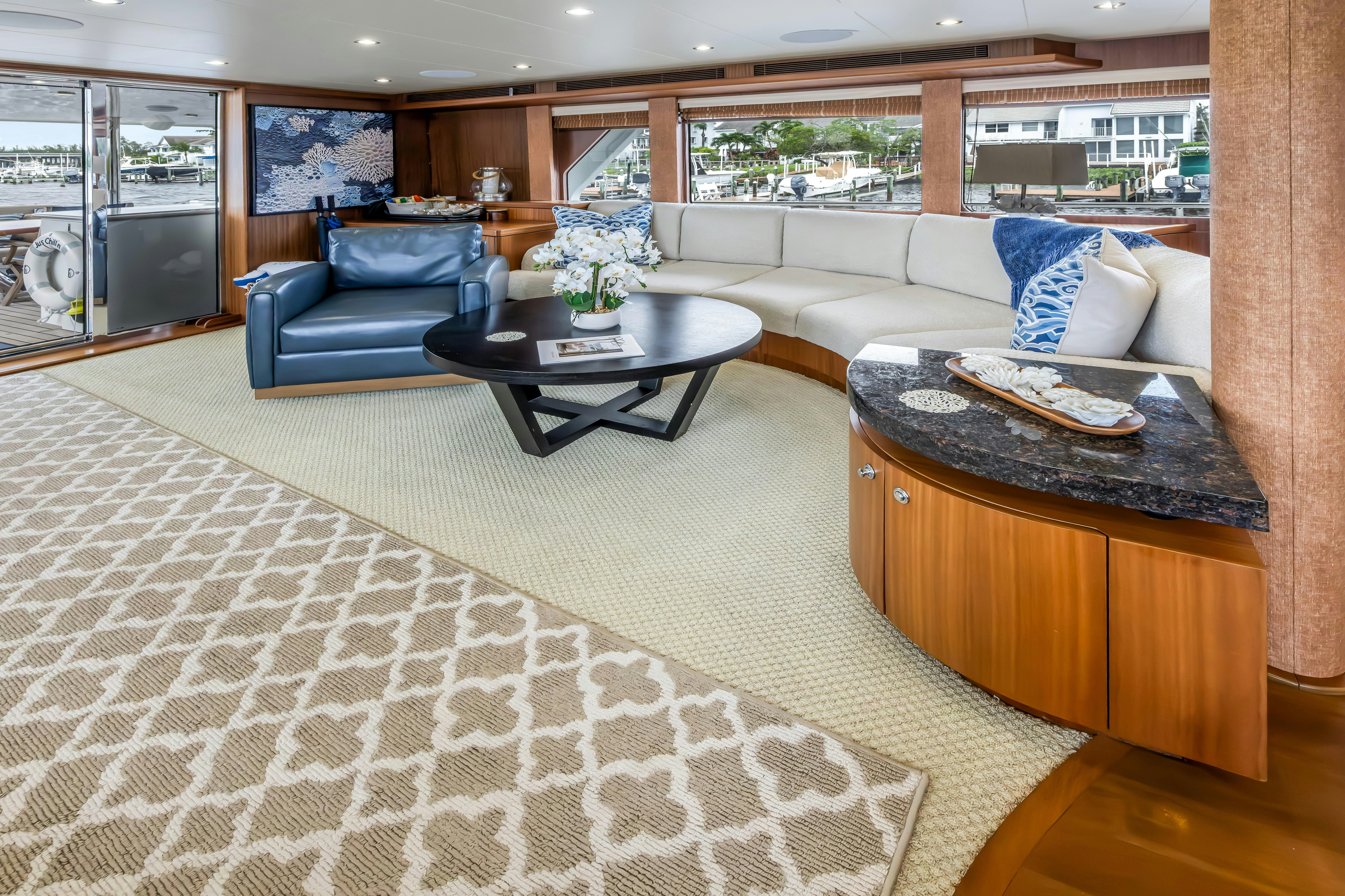 a living room with a large window aboard AURORA Yacht for Sale