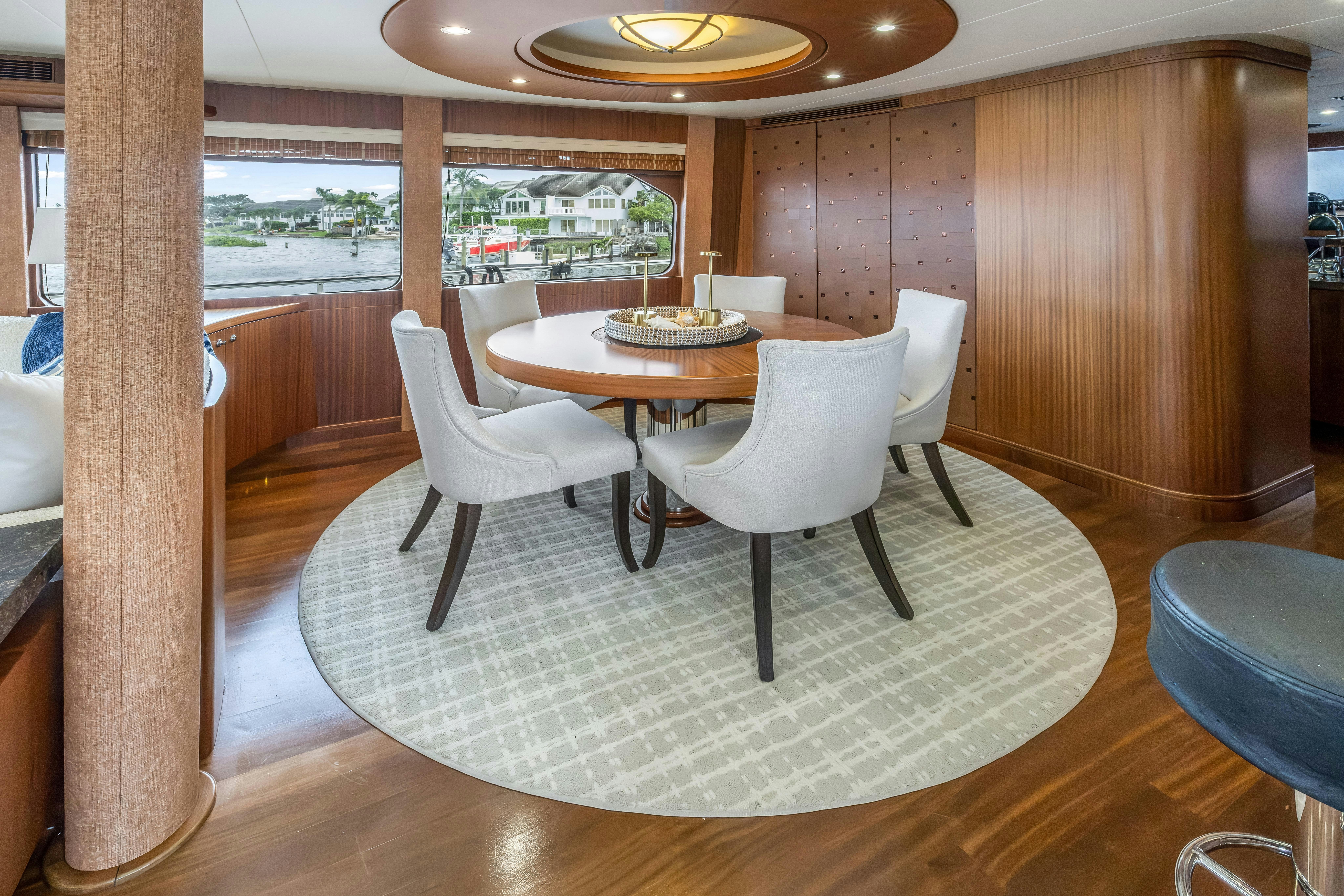a dining room with a table and chairs aboard AURORA Yacht for Sale