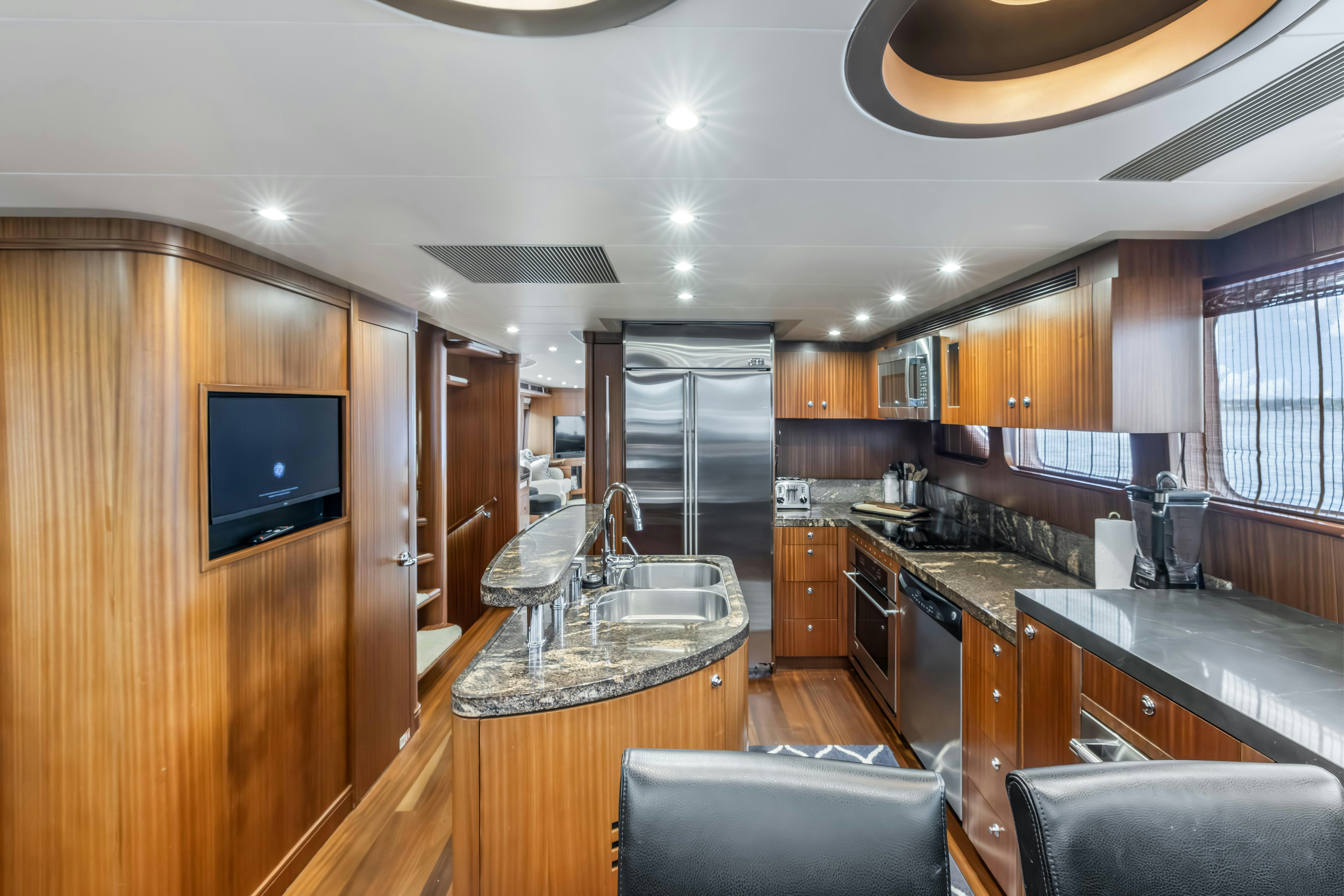 a kitchen with a large island aboard AURORA Yacht for Sale