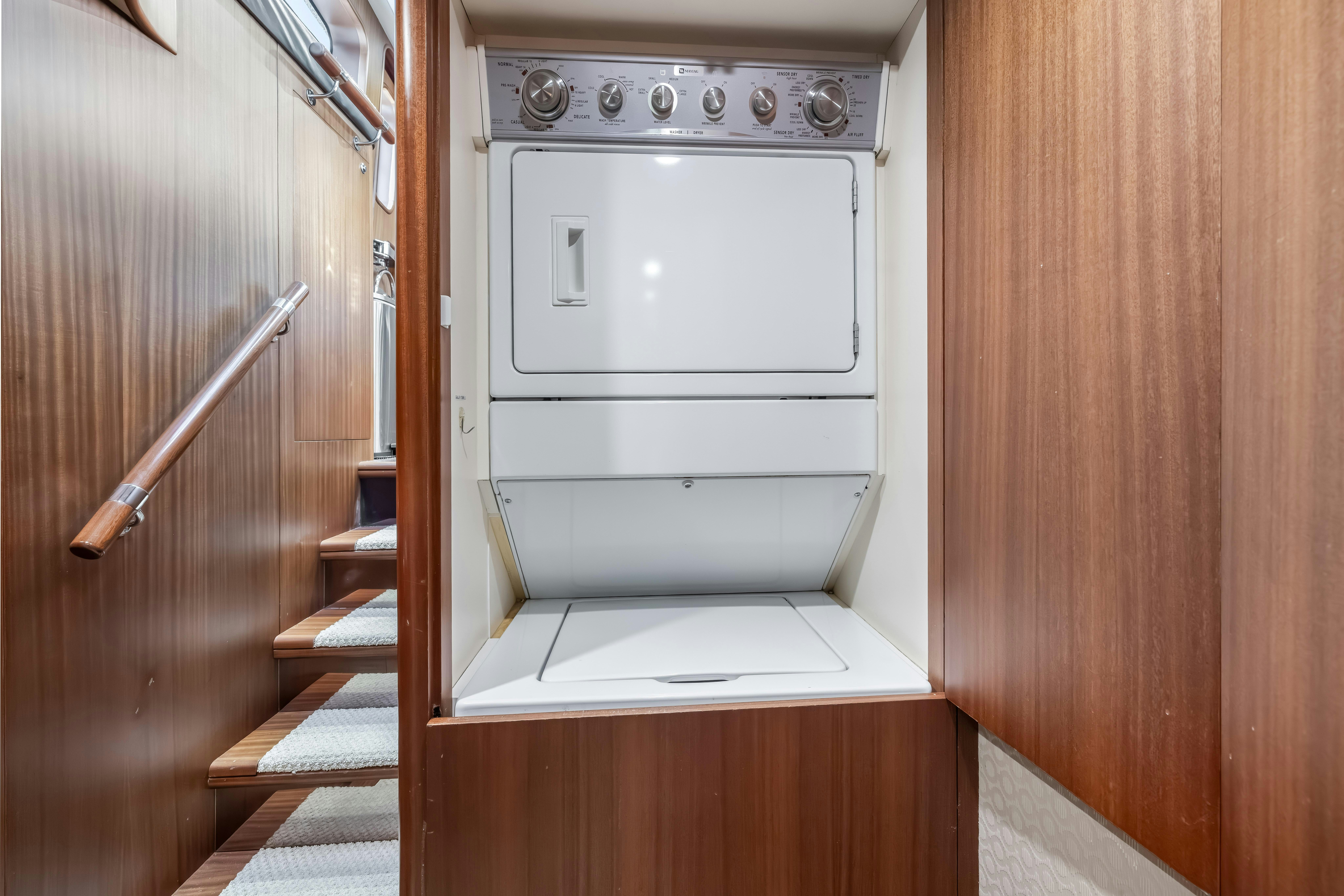 a white oven in a wooden cabinet aboard AURORA Yacht for Sale
