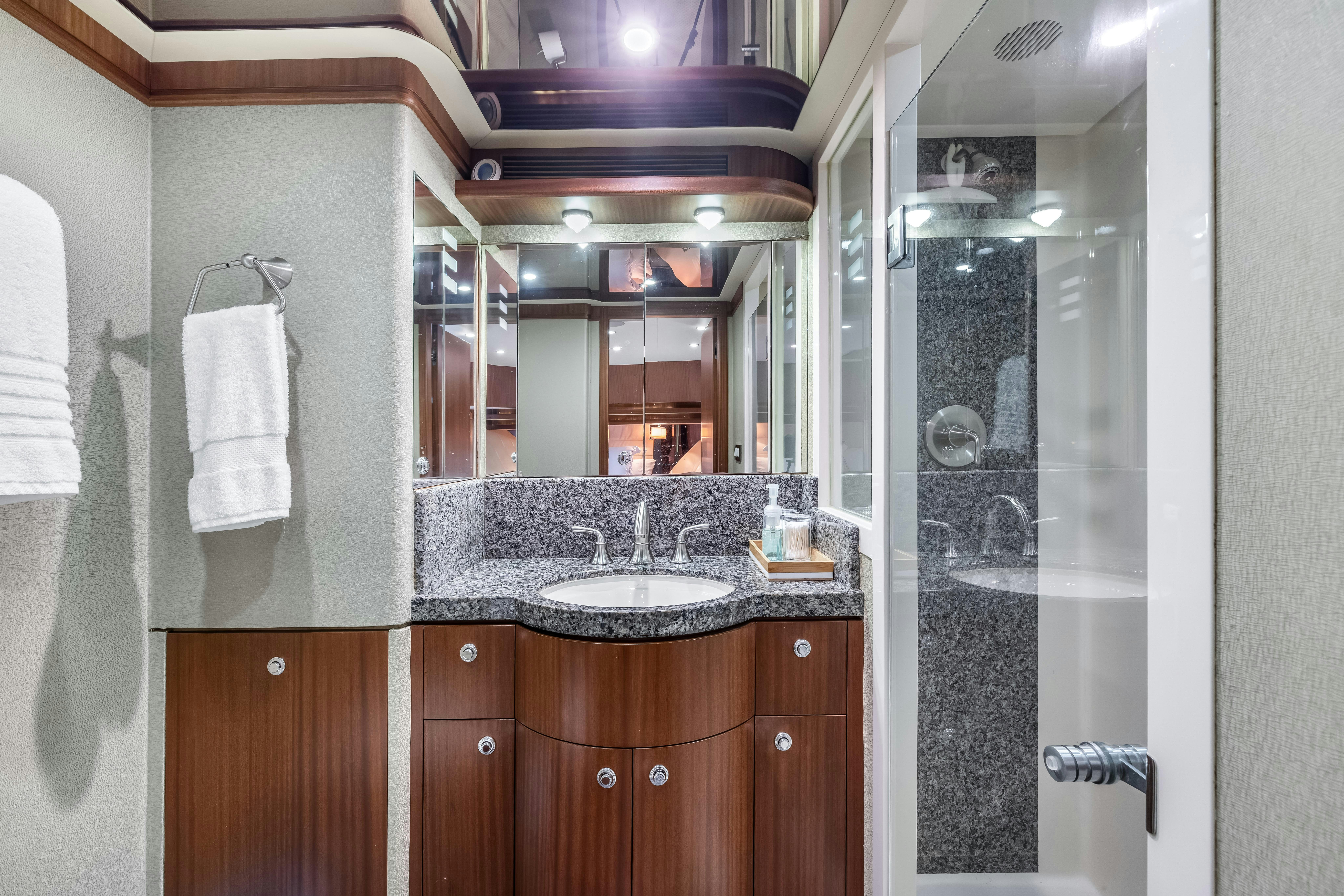 a bathroom with a sink and a mirror aboard AURORA Yacht for Sale