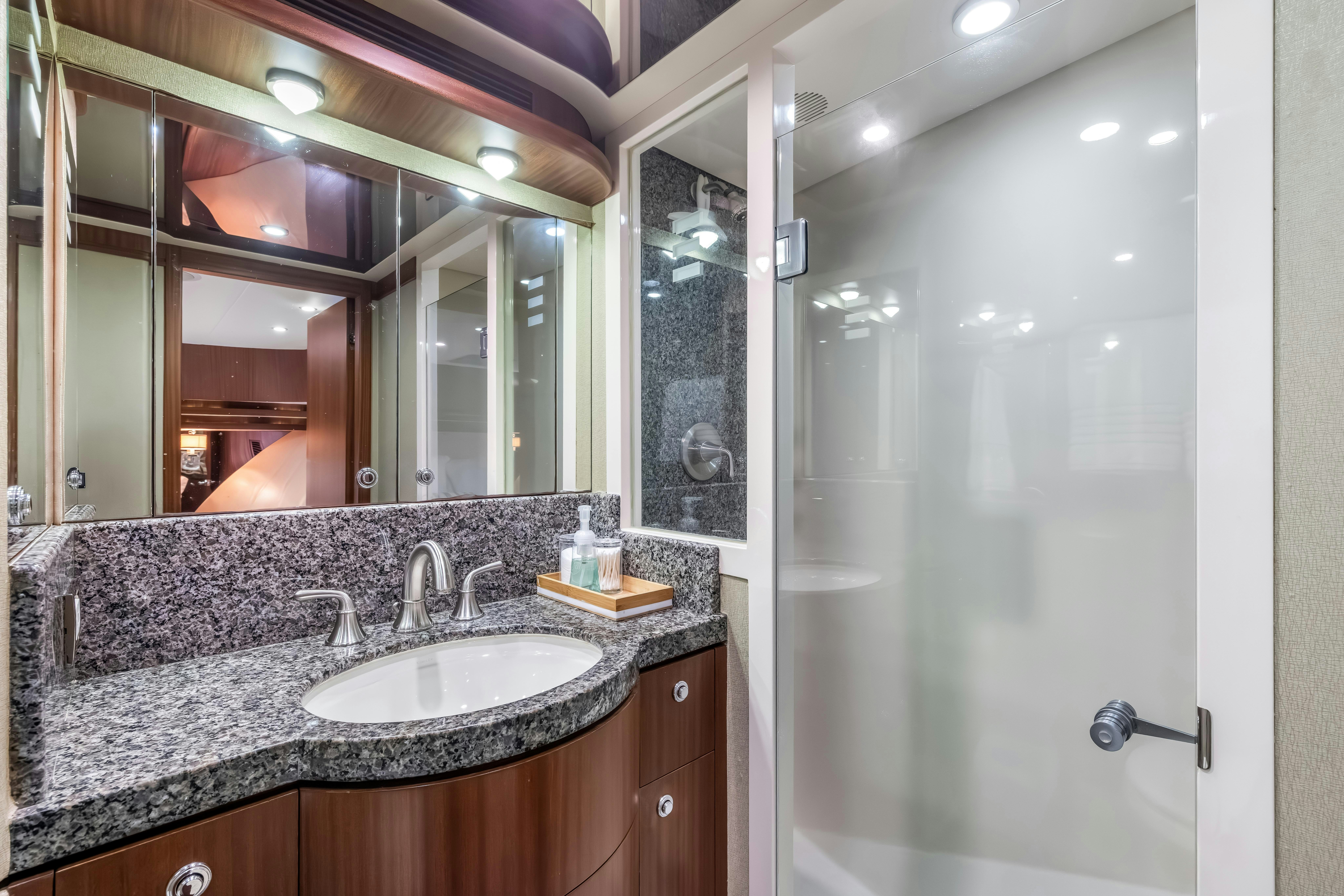 a bathroom with a large mirror aboard AURORA Yacht for Sale
